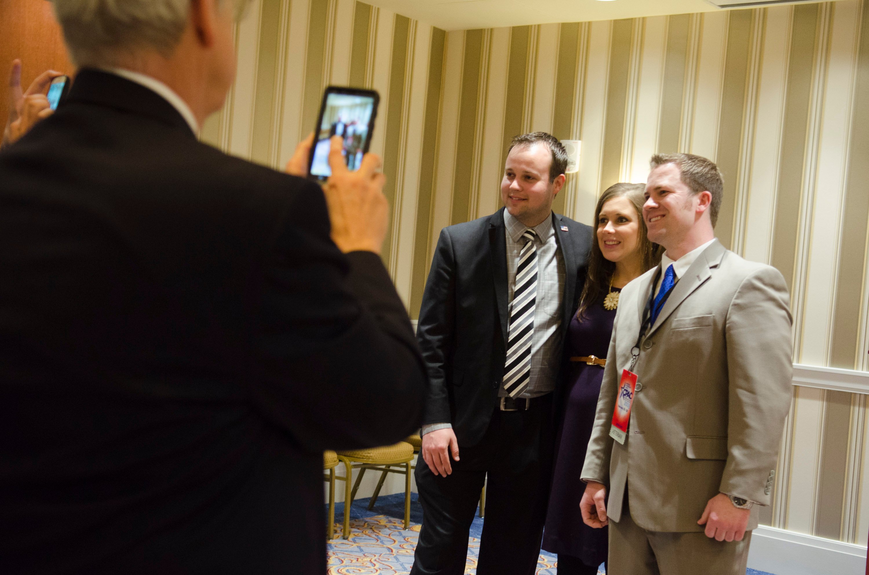 Josh Duggar and Anna Duggar pose for photos at CPAC in 2015