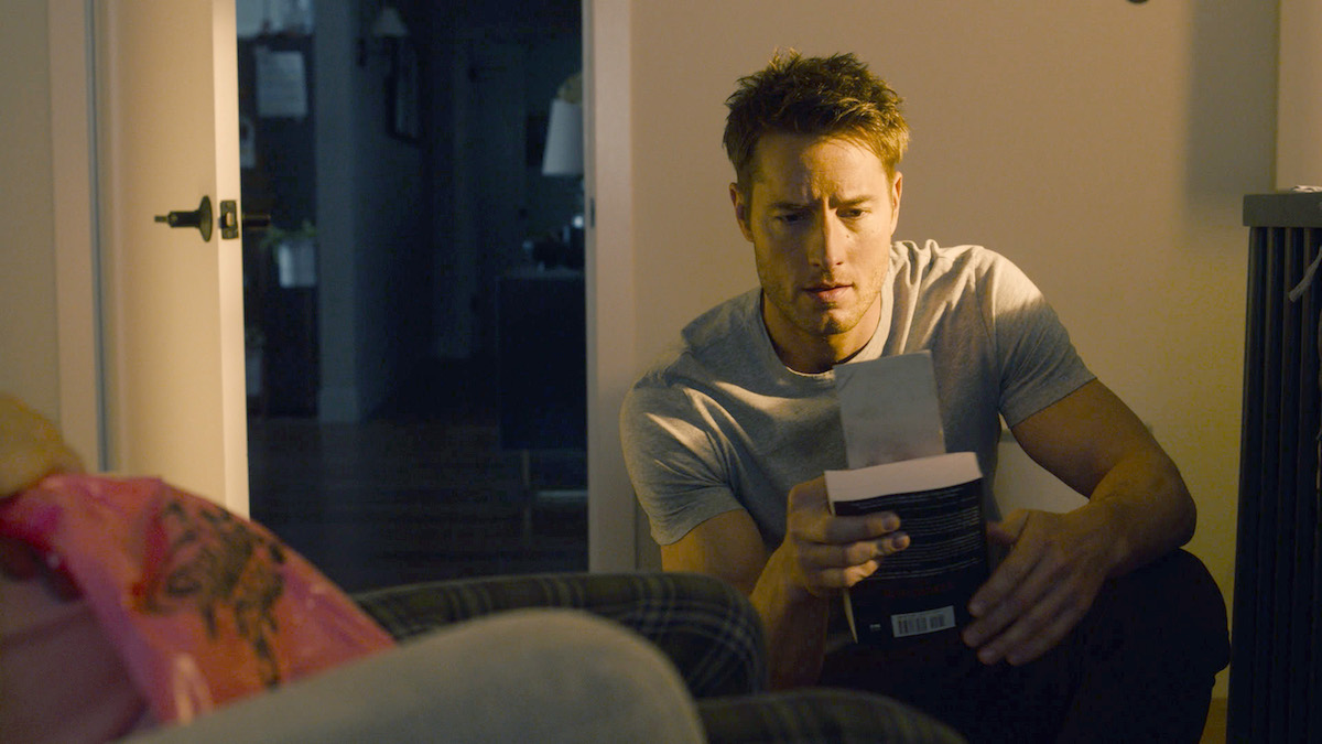 Justin Hartley as Kevin looking at a photo on 'This Is Us'