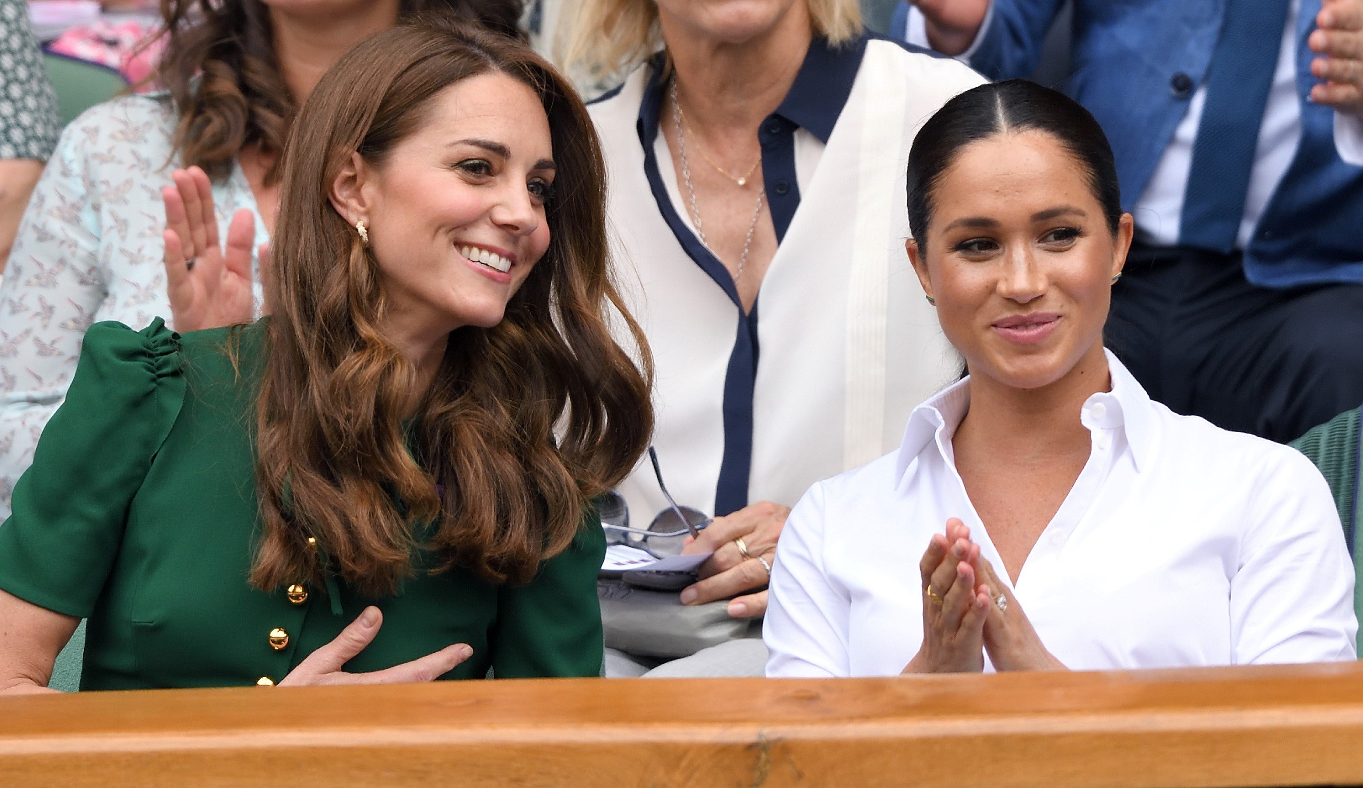 Catherine, Duchess of Cambridge and Meghan, Duchess of Sussex in the Royal Box on Centre Court during day twelve of the Wimbledon Tennis Championships