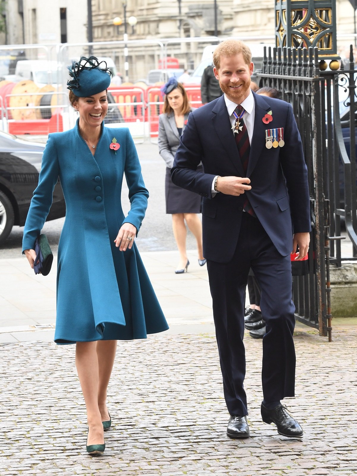 Kate Middleton and Prince Harry laughing together as they walk into Westminster Abbey for an event in 2019