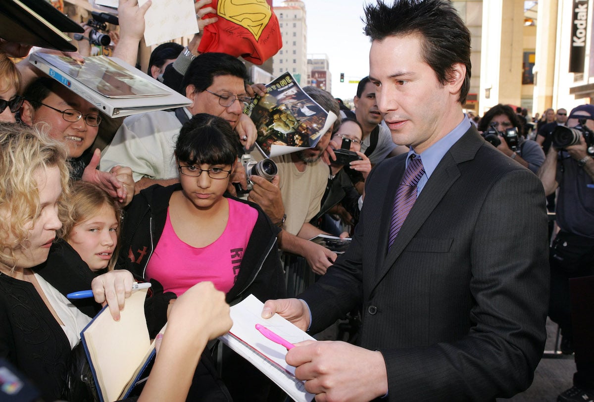 Keanu Reeves visits with fans at his Hollywood Walk of Fame ceremony in 2005 in Hollywood, Calif.
