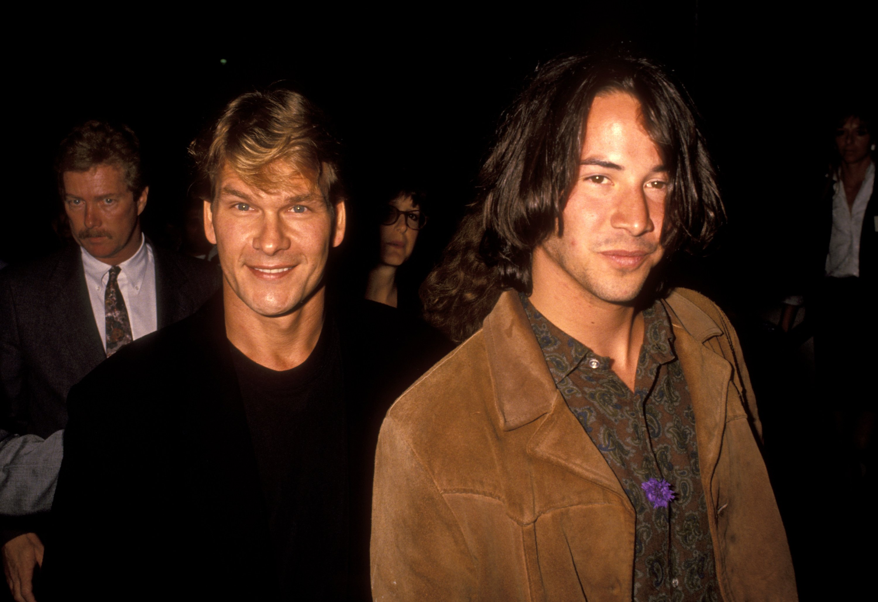 Keanu Reeves and Patrick Swayze walk the red carpet at the Point Break premiere