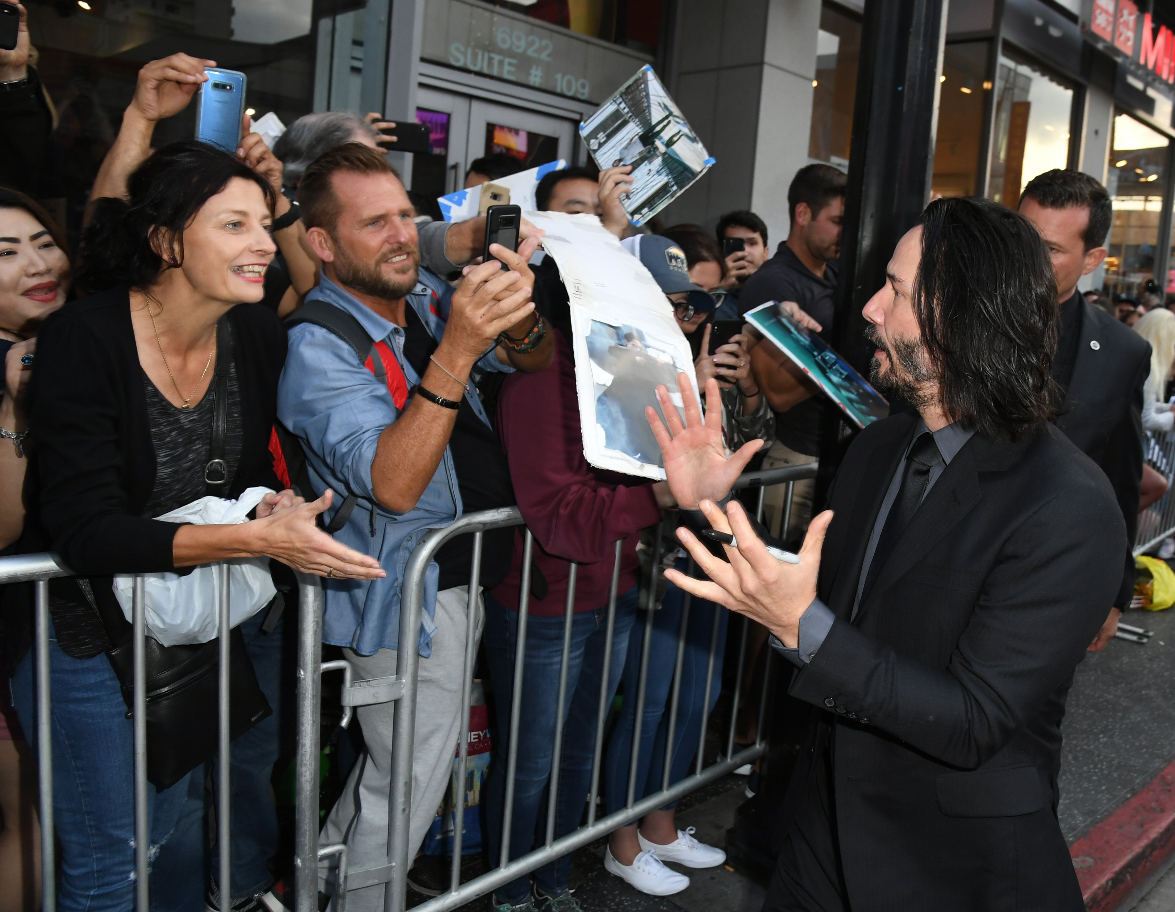 Keanu Reeves signs autographs