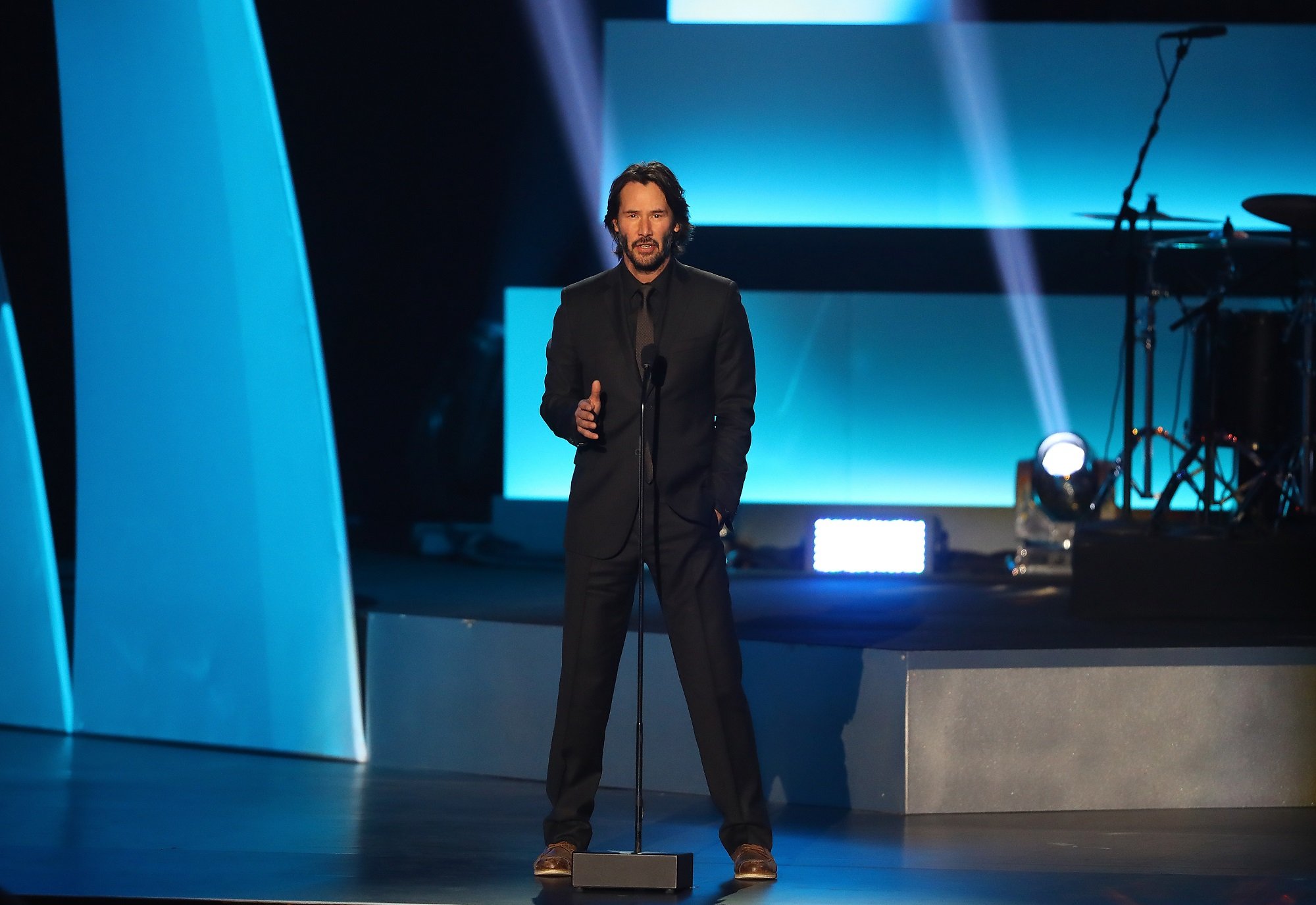 Keanu Reeves speaks on stage