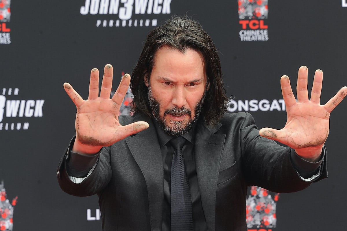 Keanu Reeves places his handprints in cement at TCL Chinese Theatre IMAX Forecourt in Hollywood, Calif. in 2019