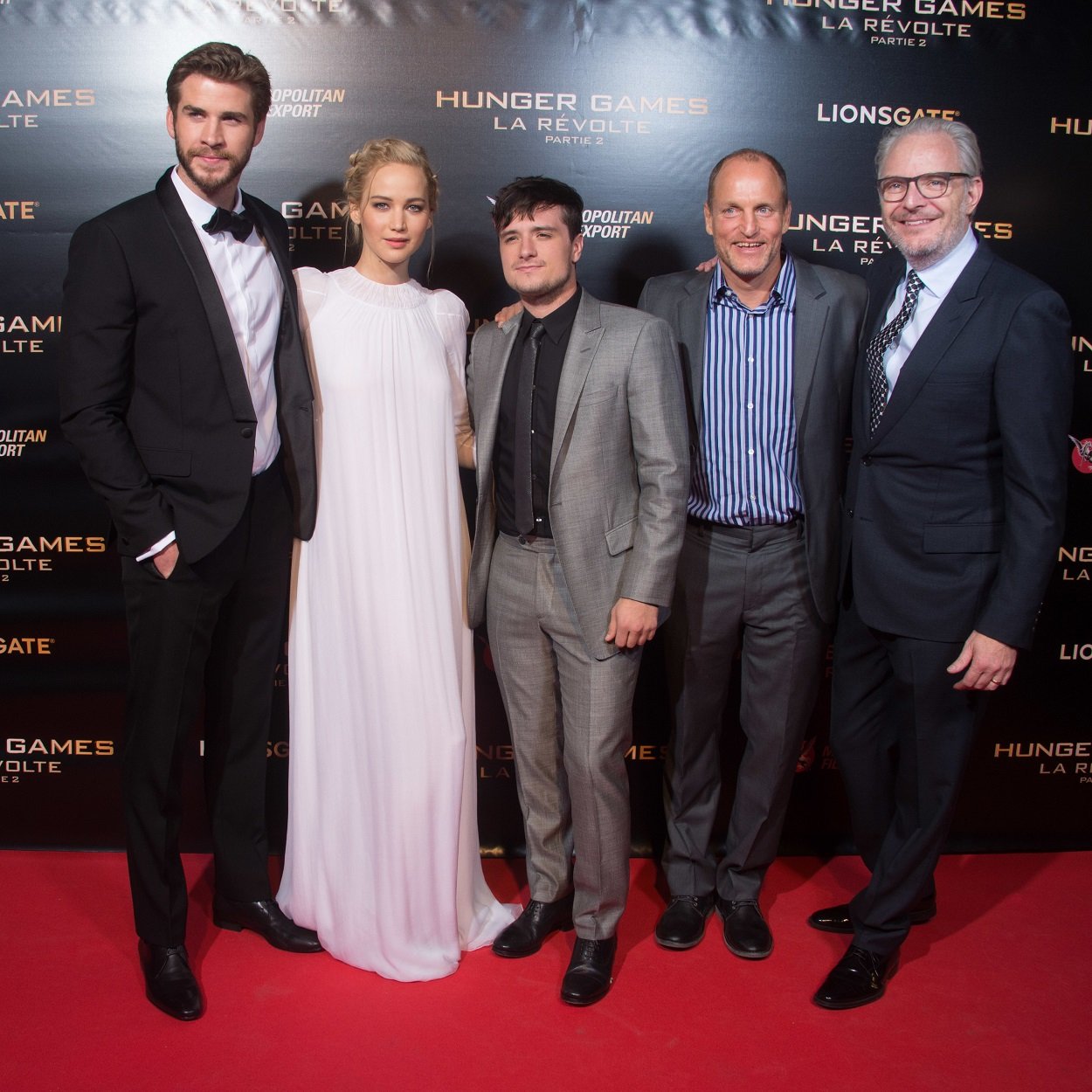 Liam Hemsworth, Jennifer Lawrence, Josh Hutcherson, Woody Harrelson, and Francis Lawrence at The Hunger Games Mockingjay Part 2 premiere in Paris