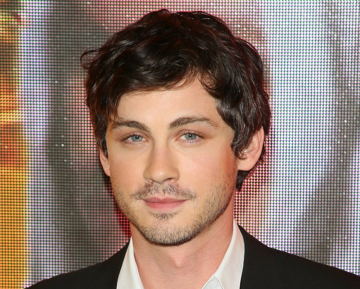 Logan Lerman attends the premiere of Amazon Prime Video's 'Hunters' in a black suit and white shirt