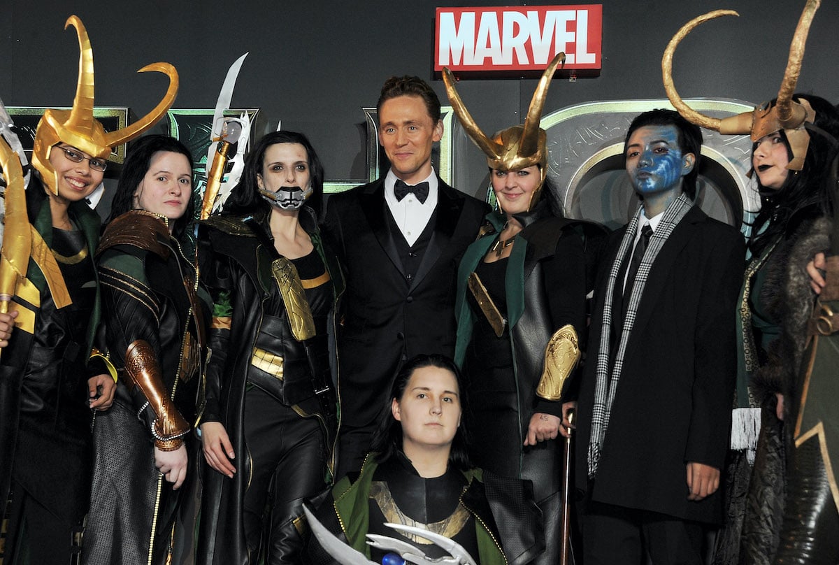 Tom Hiddleston poses with Looki-Loki's at the World Premiere of 'Thor: The Dark World' in London