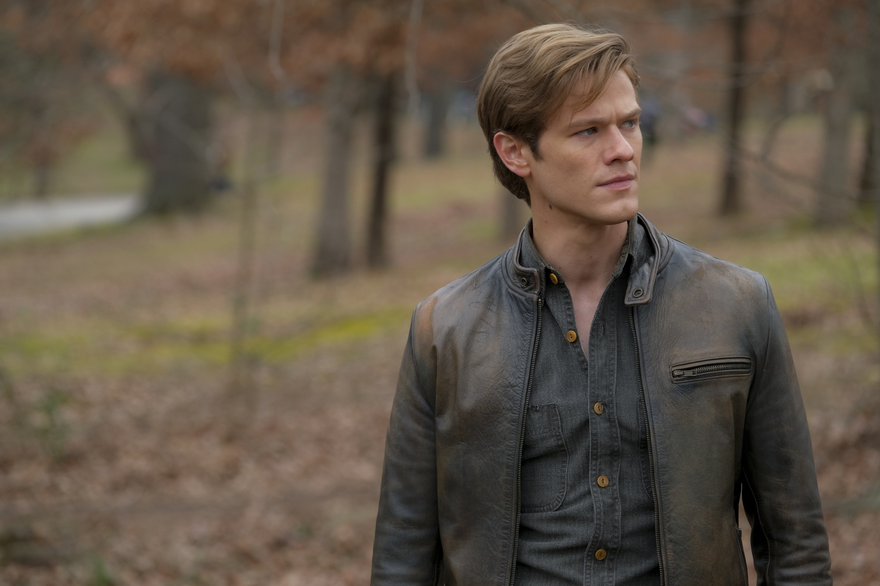 Lucas Till as MacGyver looking at something to his left