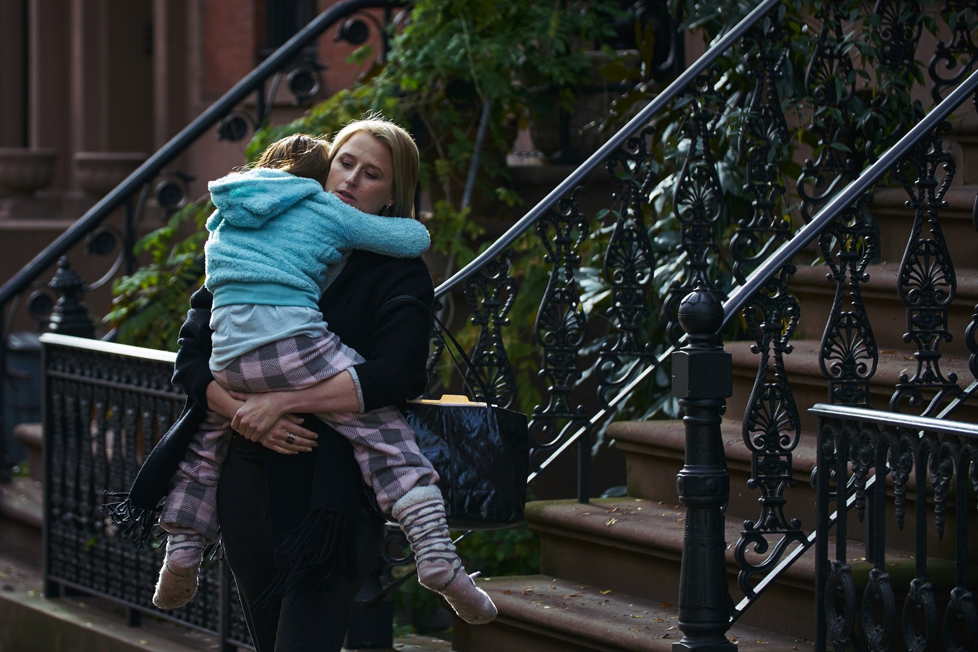 Mamie Gummer holds Violet McGraw in Separation