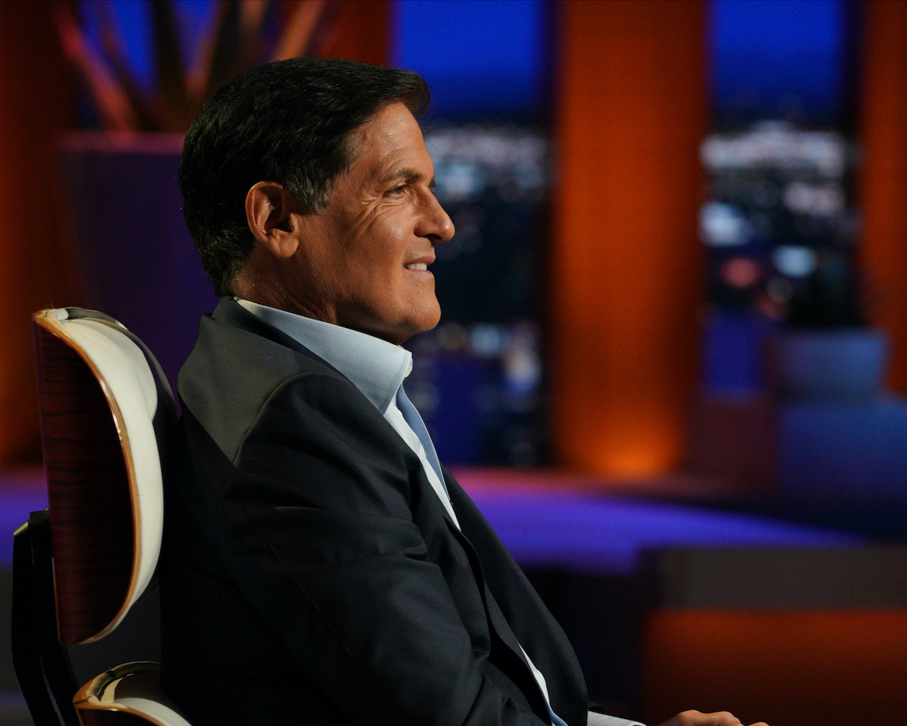 Mark Cuban sits on the panel of 'Shark Tank' in a blue jacket