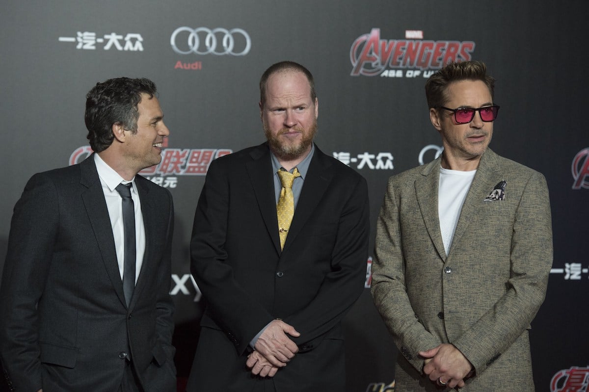 Mark Ruffalo, Joss Whedon and Robert Downey Jr stand next to each other on the red carpet.