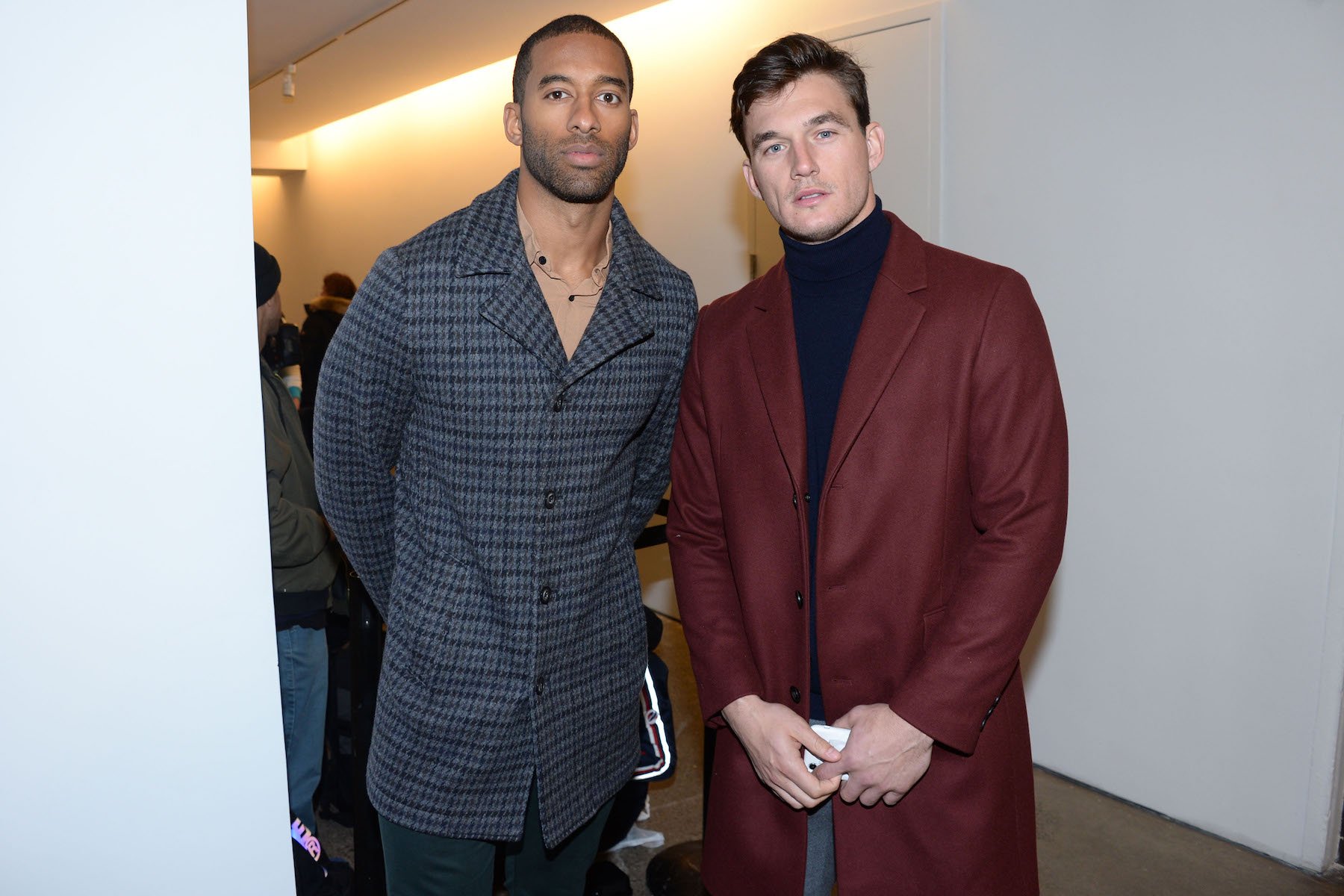 Matt James from 'The Bachelor' and Tyler Cameron from 'The Bachelorette' standing together at a fashion show