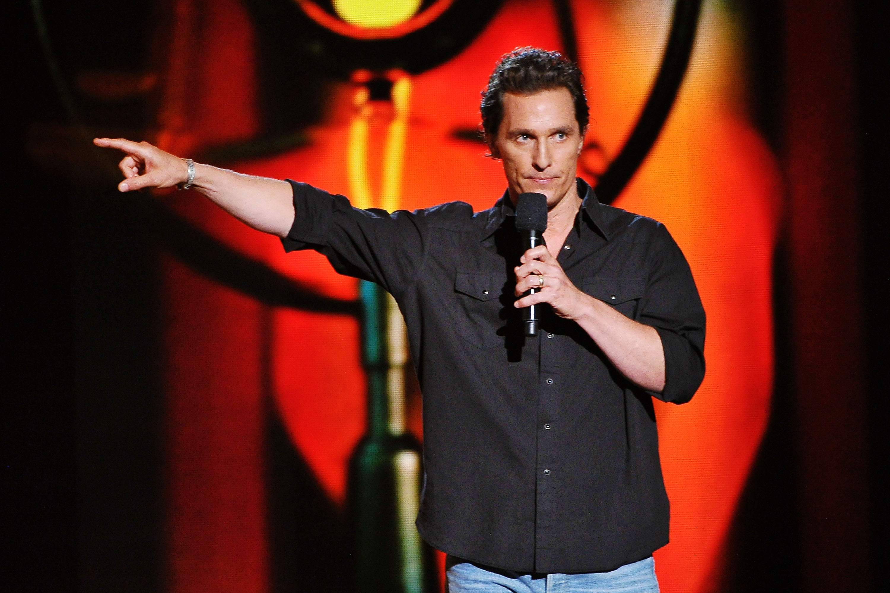 Matthew McConaughey points on stage