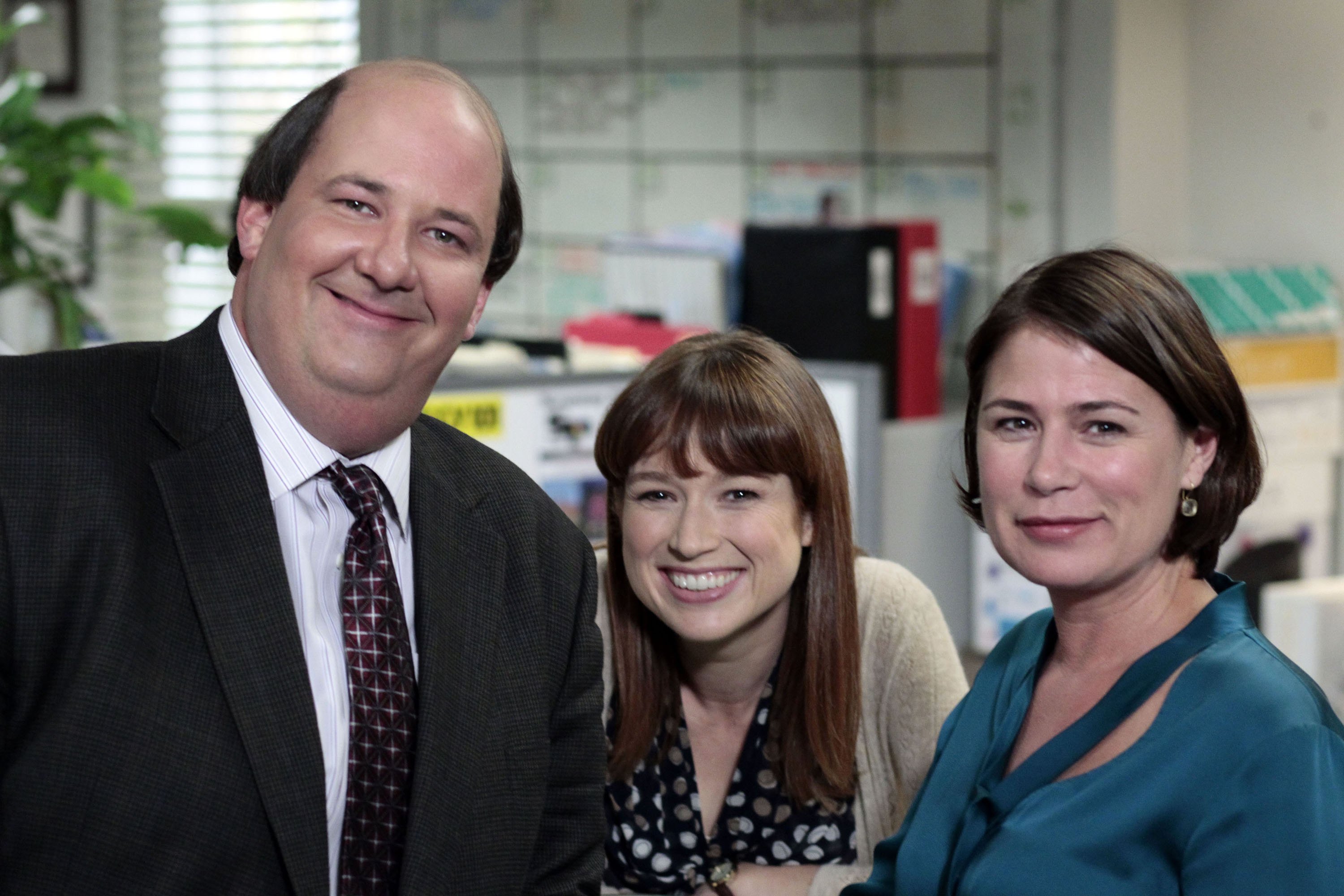 Brian Baumgartner as Kevin Malone, Ellie Kemper as Kelly Erin Hannon, Maura Tierney as Susan California on the set of The Office