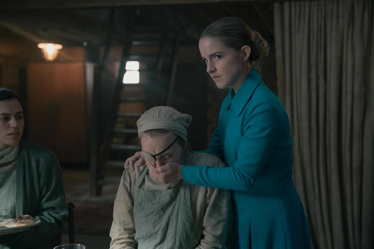 Mckenna Grace as Mrs. Esther Keyes (R) holding her hand over Janine's (Madeline Brewer) mouth in 'The Handmaid's Tale' Season 4