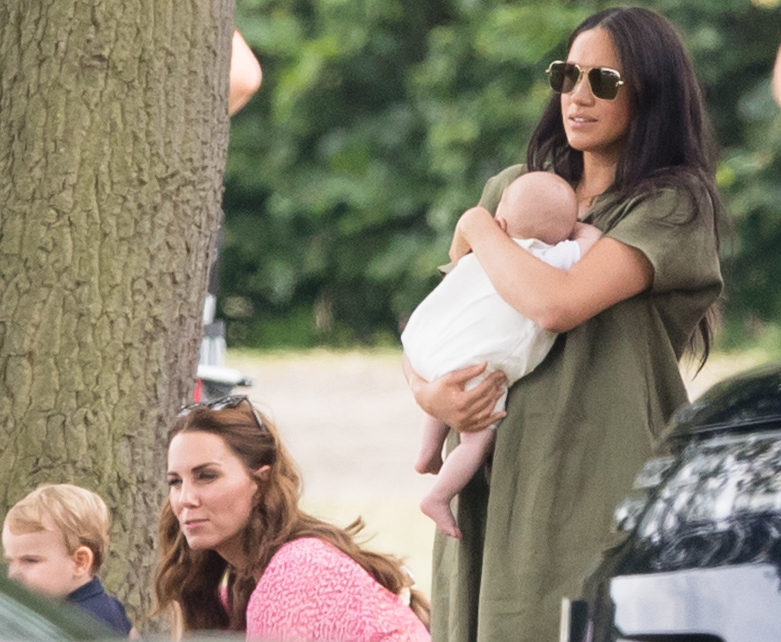 Meghan Markle and Kate Middleton in the park with their children as they watch their husbands play charity polo match