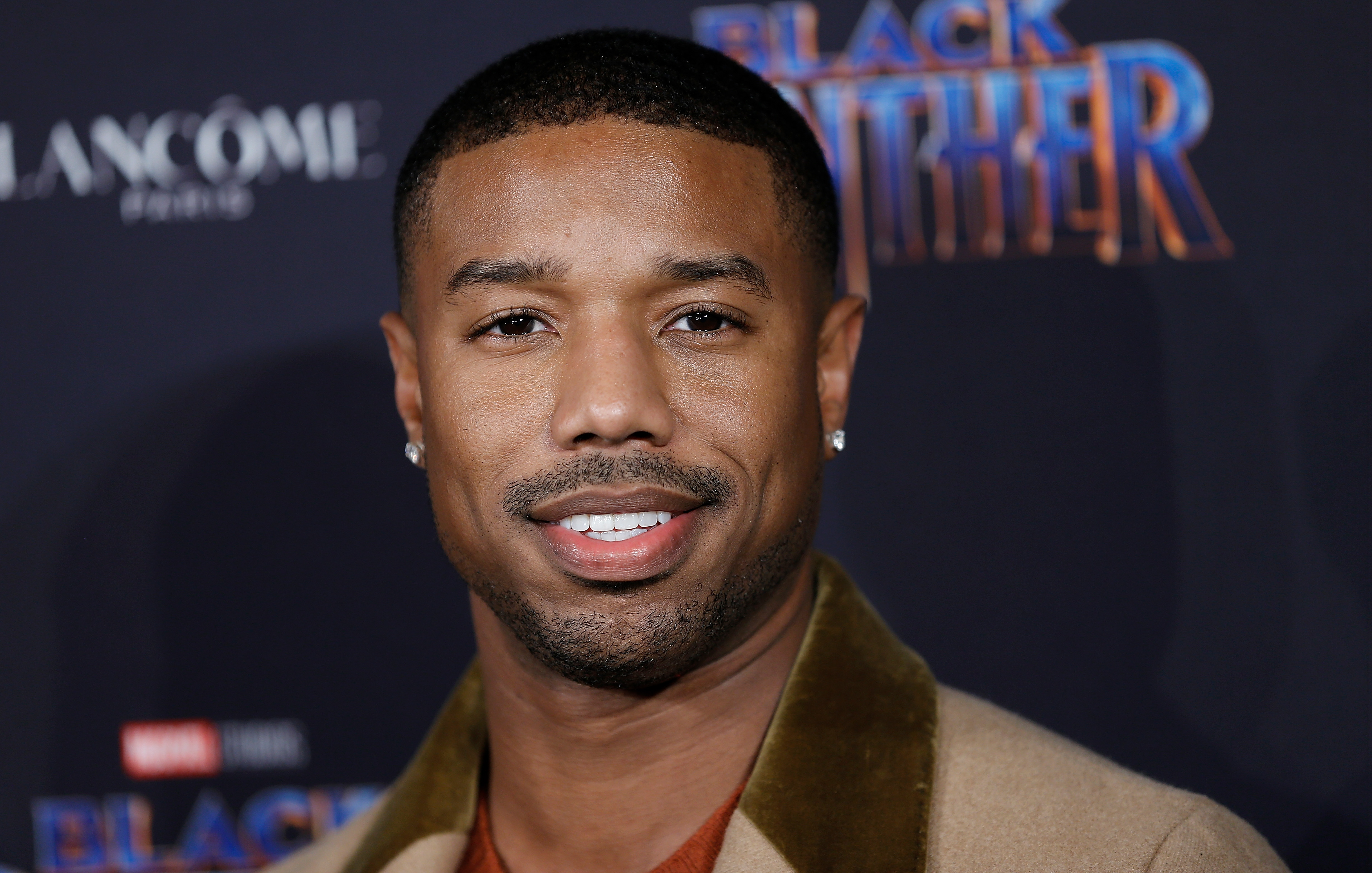Michael B. Jordan of 'Black Panther' smiles for cameras as he attends Marvel Studios Presents: Black Panther Welcome To Wakanda during February 2018  New York Fashion Week: The Shows at Industrial Studios