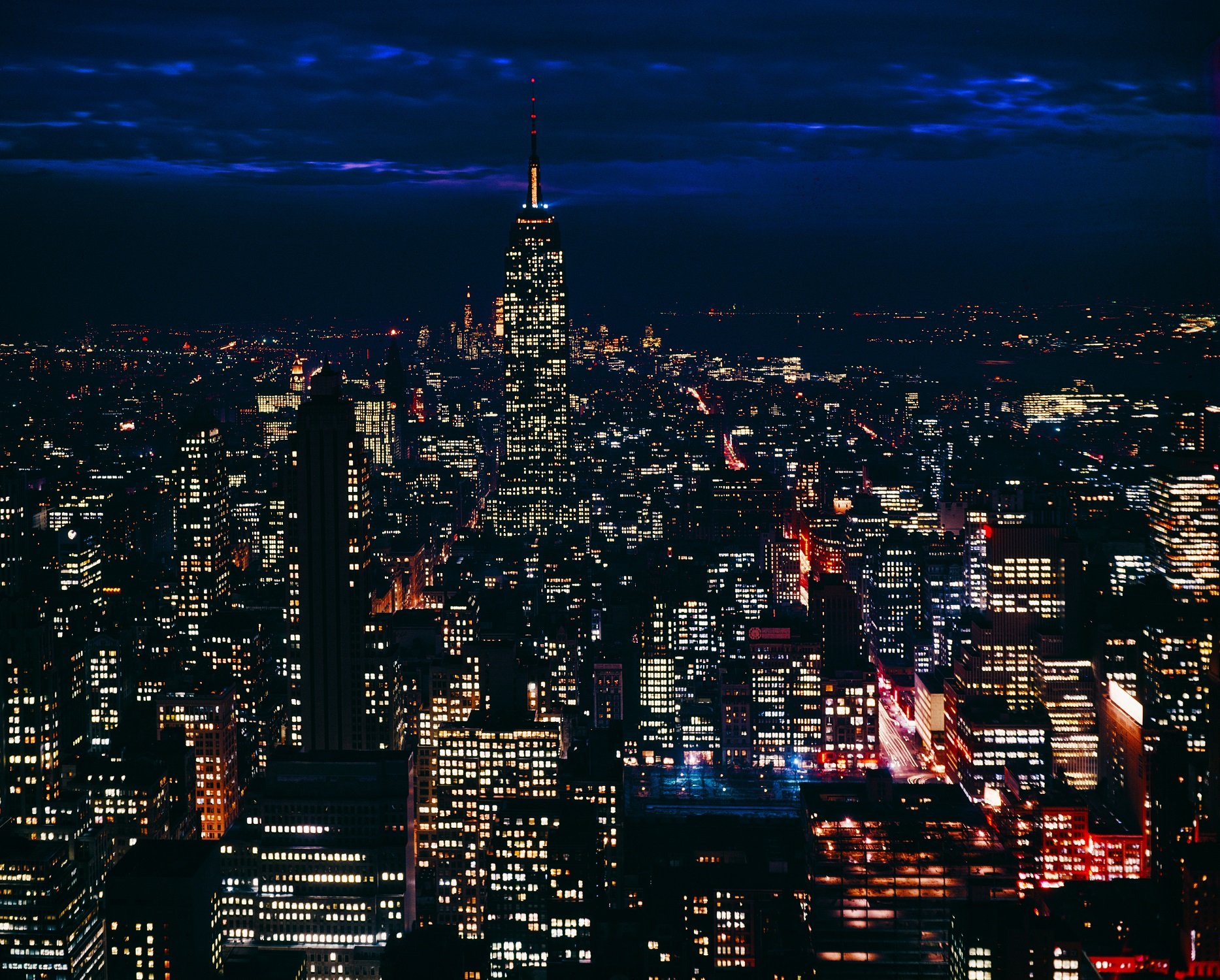 A skyline image of New  York City at Night in the 1960s