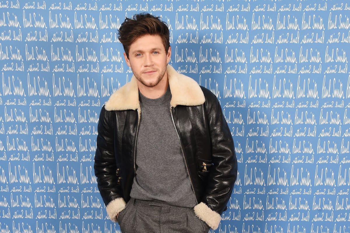 Niall Horan in a leather jacket and grey top