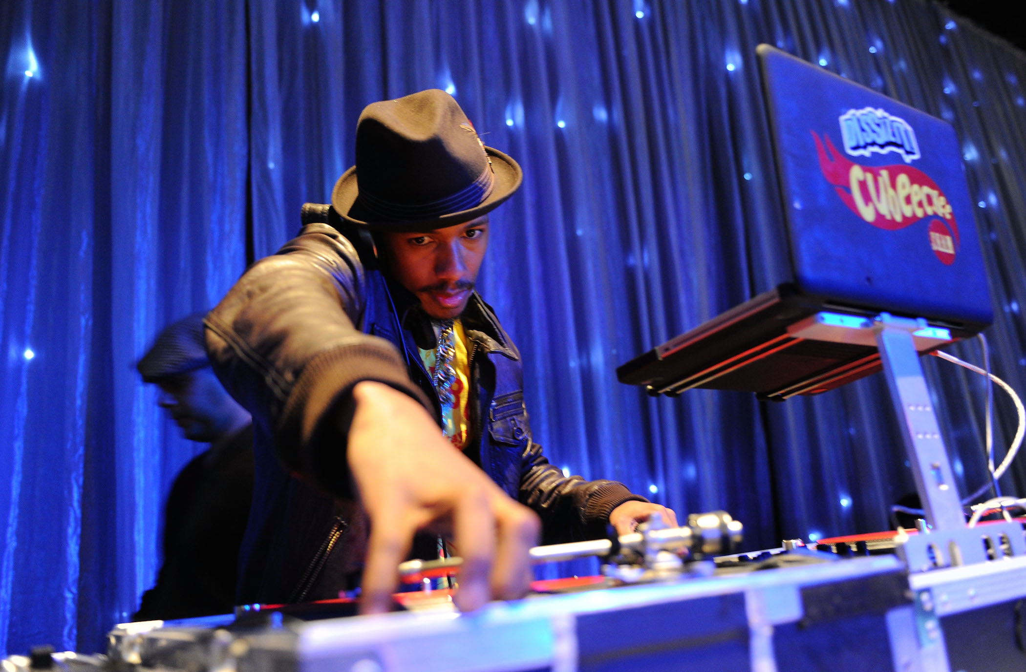 Nick Cannon DJing his birthday party. Nick Cannon's age is 30 in the photo