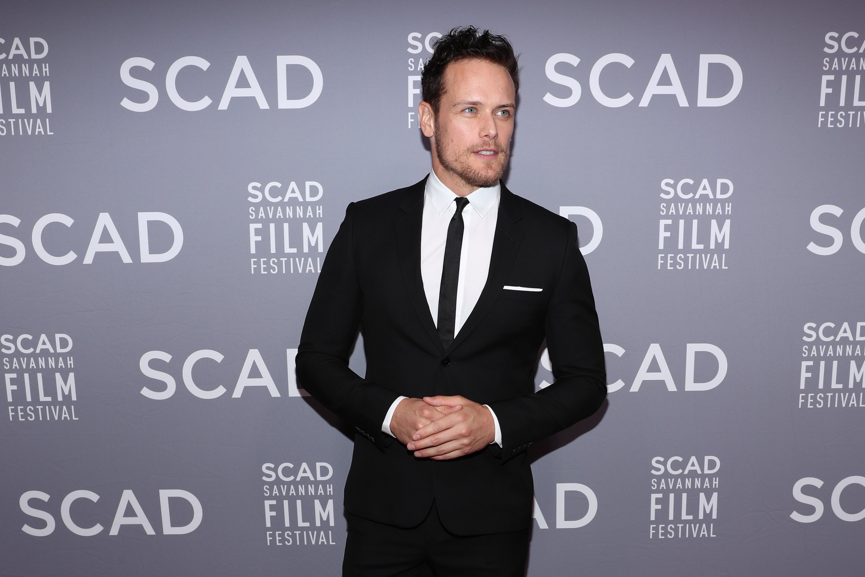 Sam Heughan the 21st SCAD Savannah Film Festival Red Carpet for "Outlander" Season Four on October 28, 2018 in Savannah, Georgia