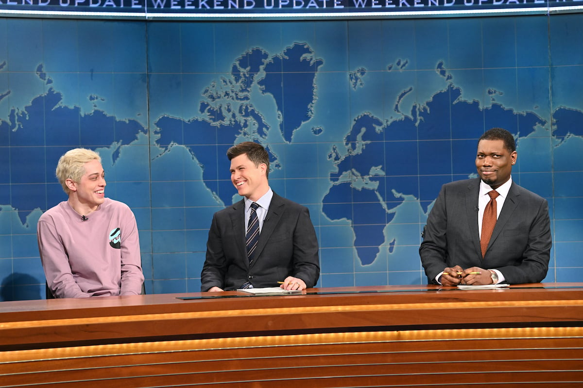 Pete Davidson, Colin Jost, and anchor Michael Che on Weekend Update on SNL