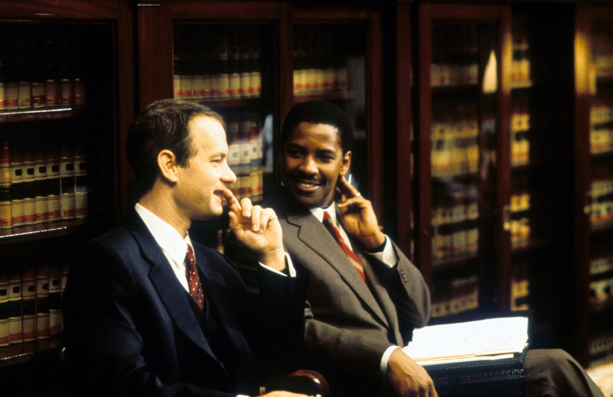 Philadelphia stars Tom Hanks and Denzel Washington sit in a law office