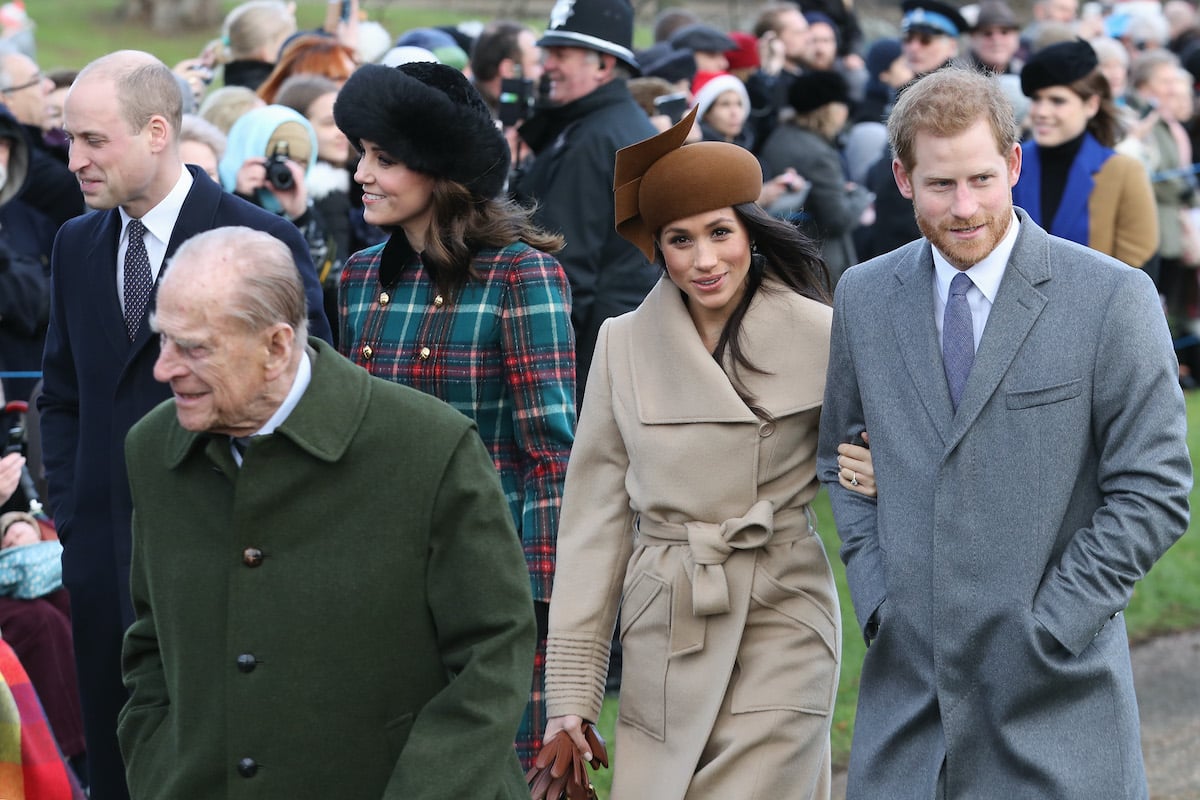 Prince William, Duke of Cambridge, Prince Philip, Duke of Edinburgh, Catherine, Duchess of Cambridge, Meghan, Duchess of Sussex, and Prince Harry, Duke of Sussex walk outside in Sandringham on Christmas Day 2017