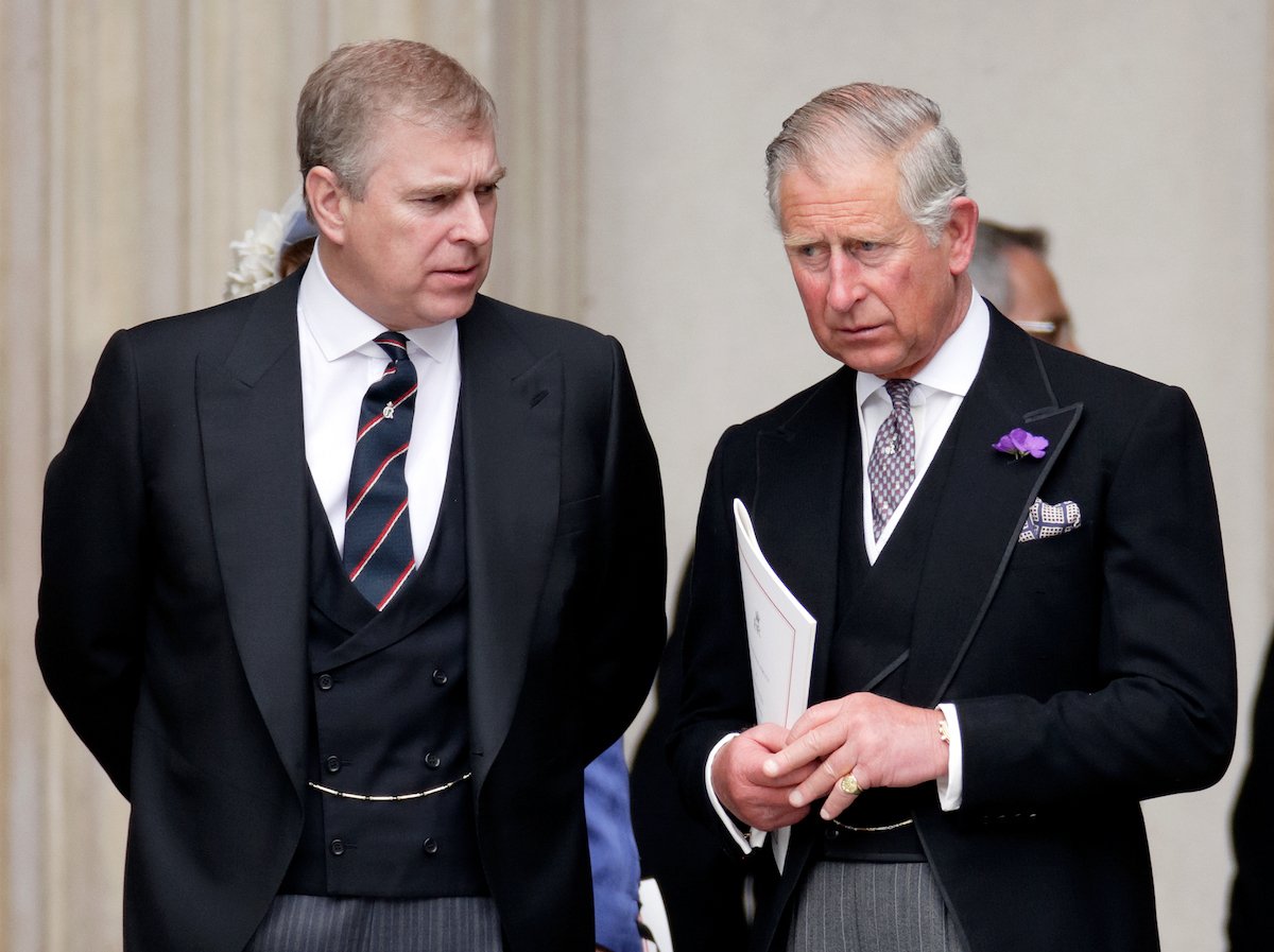 Prince Charles and Prince Andrew speak privately