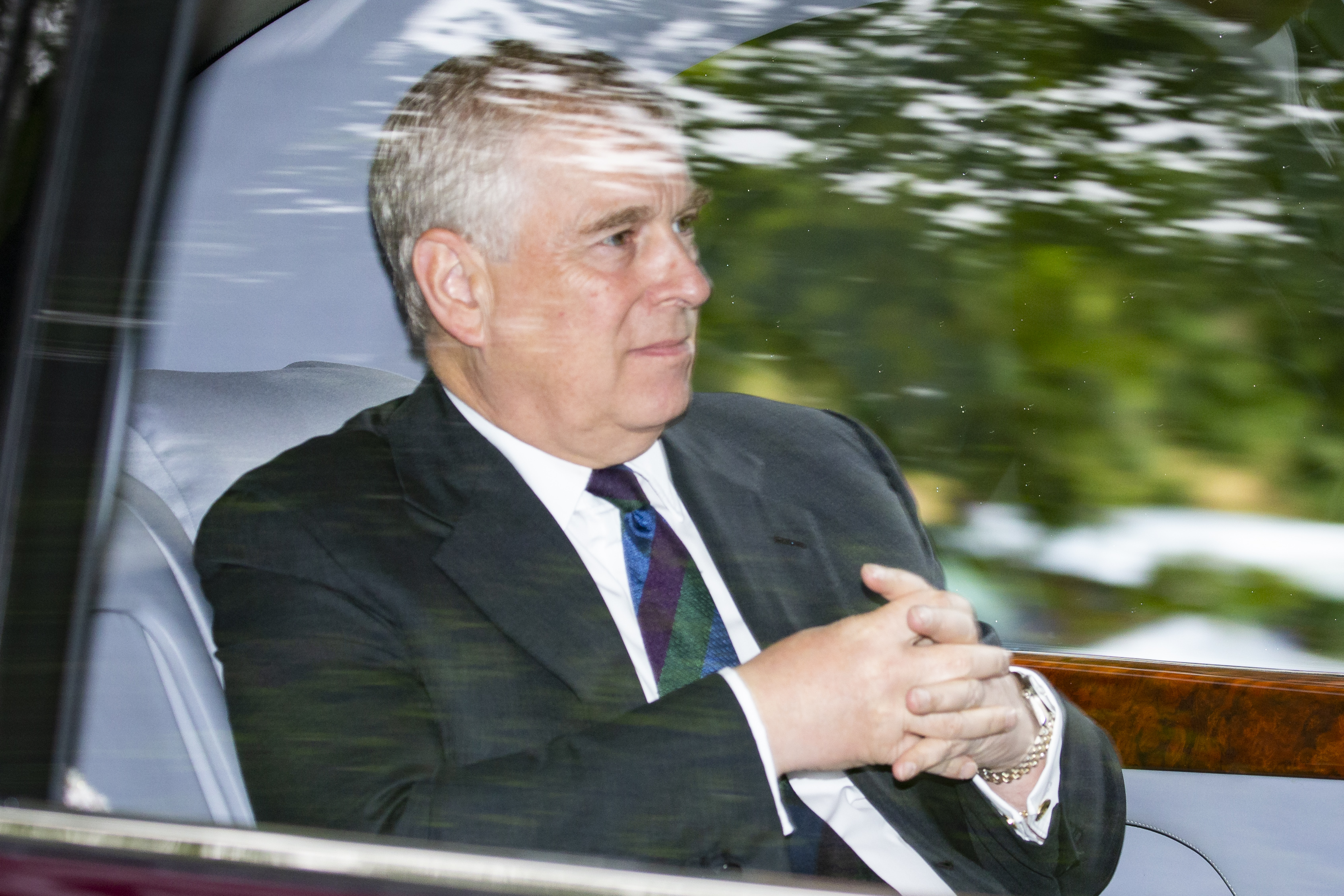 Prince Andrew, being driven in car away from Crathie Kirk Church following the service