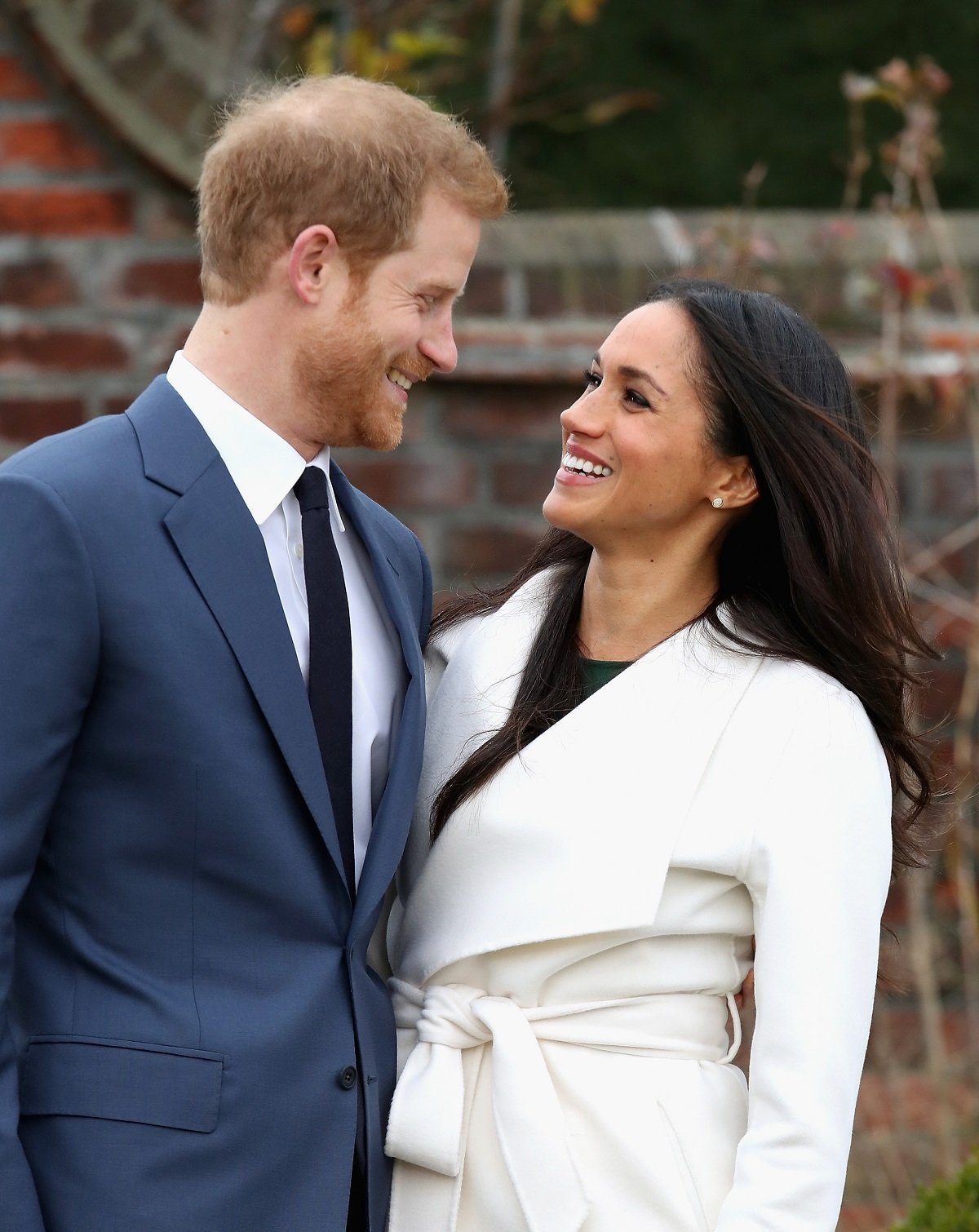 Prince Harry and Meghan Markle during an official photocall to announce the engagement of Prince Harry and actress Meghan Markle at The Sunken Gardens at Kensington Palace on November 27, 2017 in London, England.