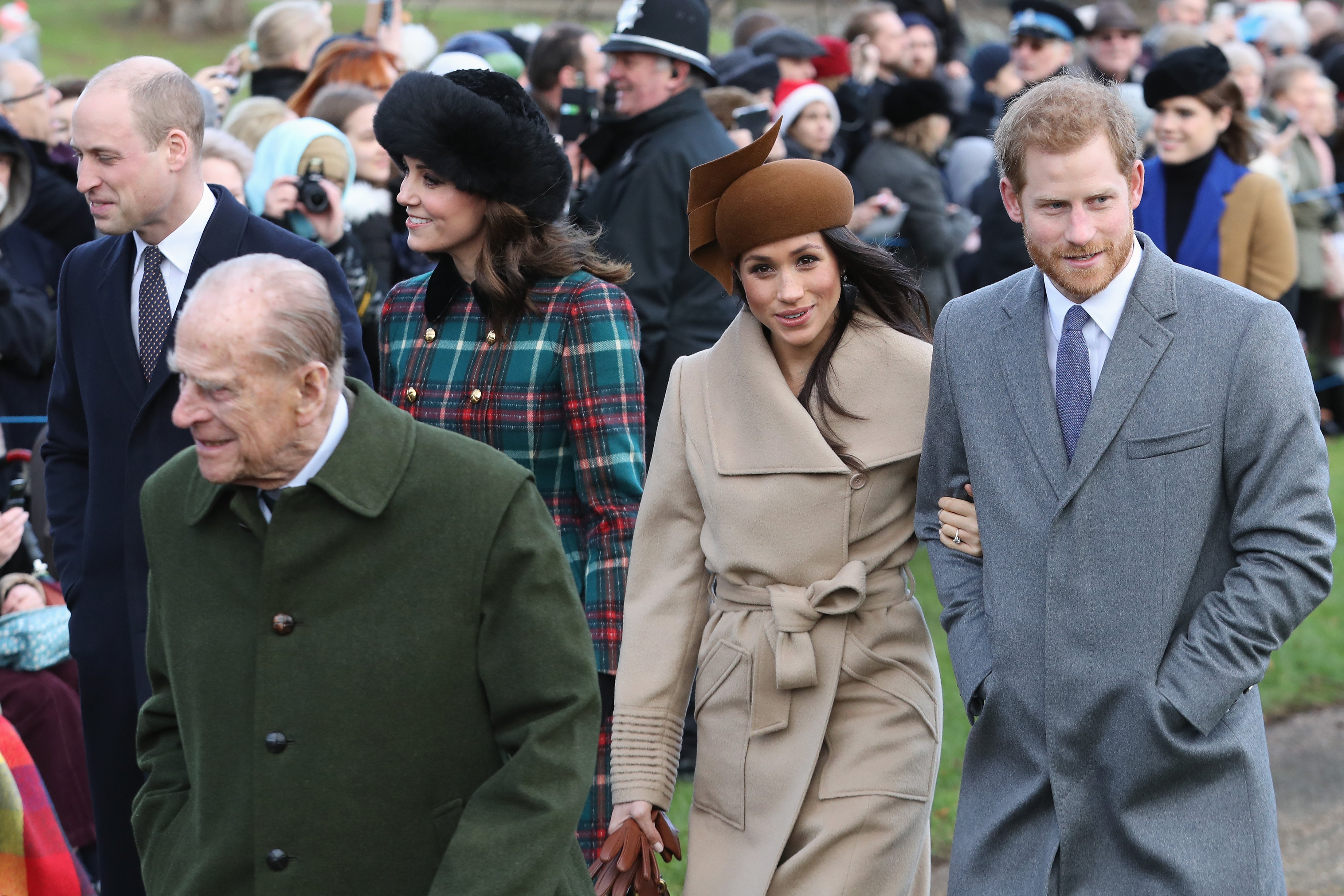 Prince Philip walks ahead of Prince Harry and Meghan Markle on Christmas in 2017