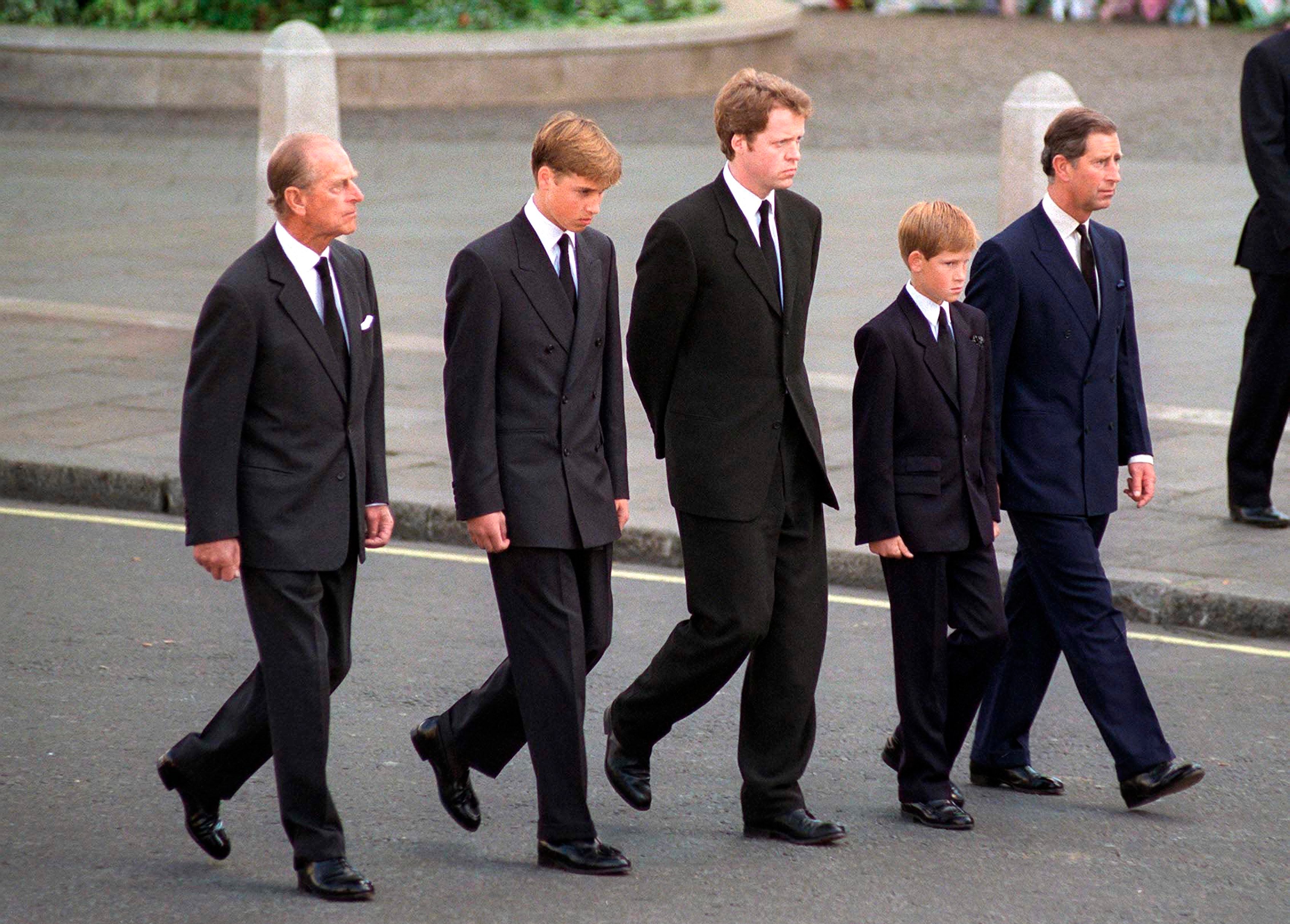 Prince Philip,, Prince William, Earl Spencer, Prince Harry, and Prince Charles walking behind Princess Diana's coffin