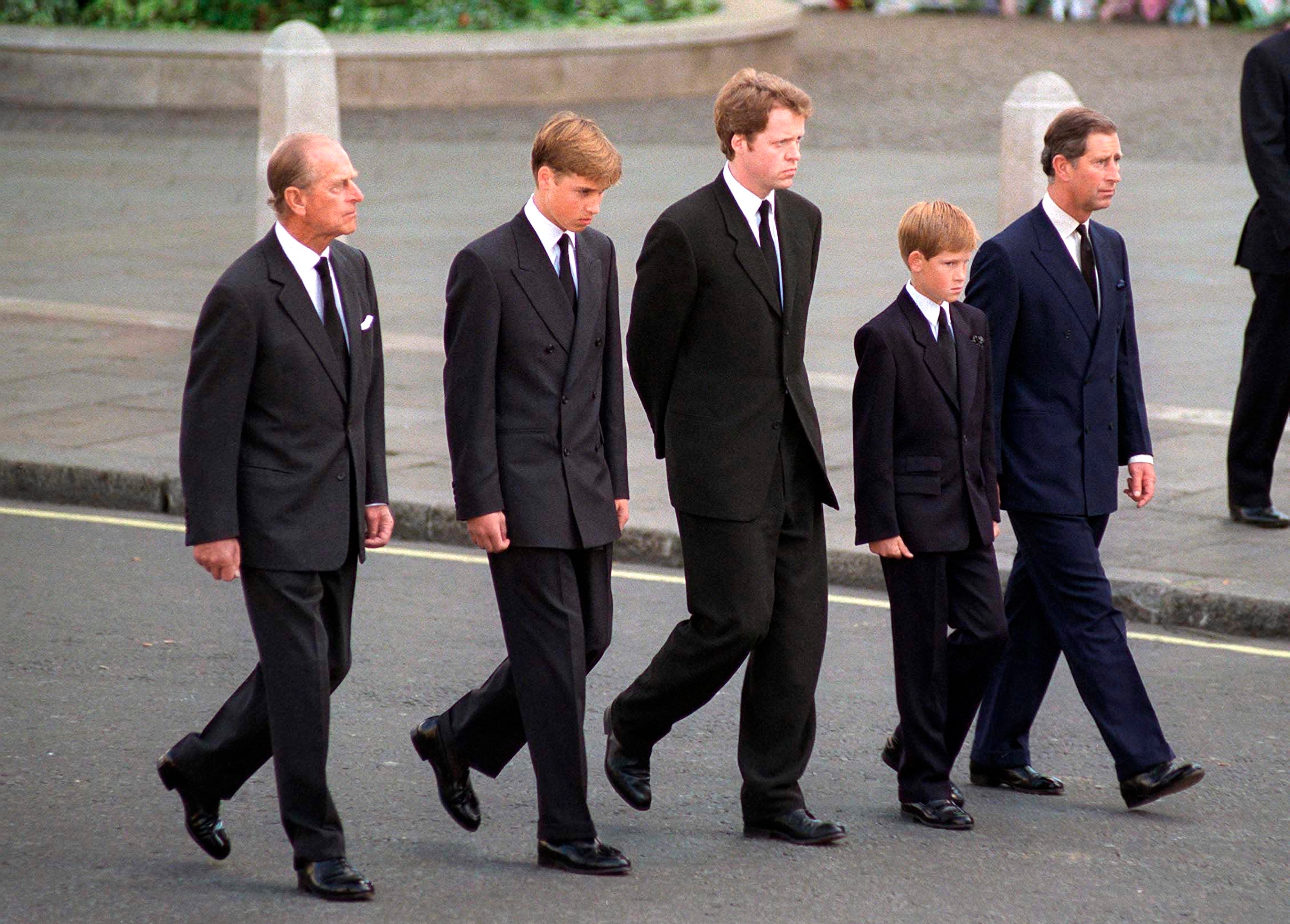 Prince Philip,, Prince William, Earl Spencer, Prince Harry, and Prince Charles walking behind Princess Diana's coffin