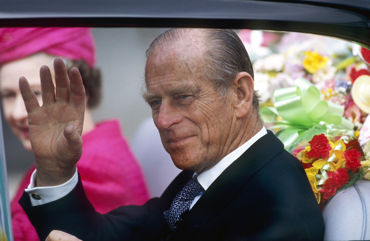 Prince Philip waving at a crowd
