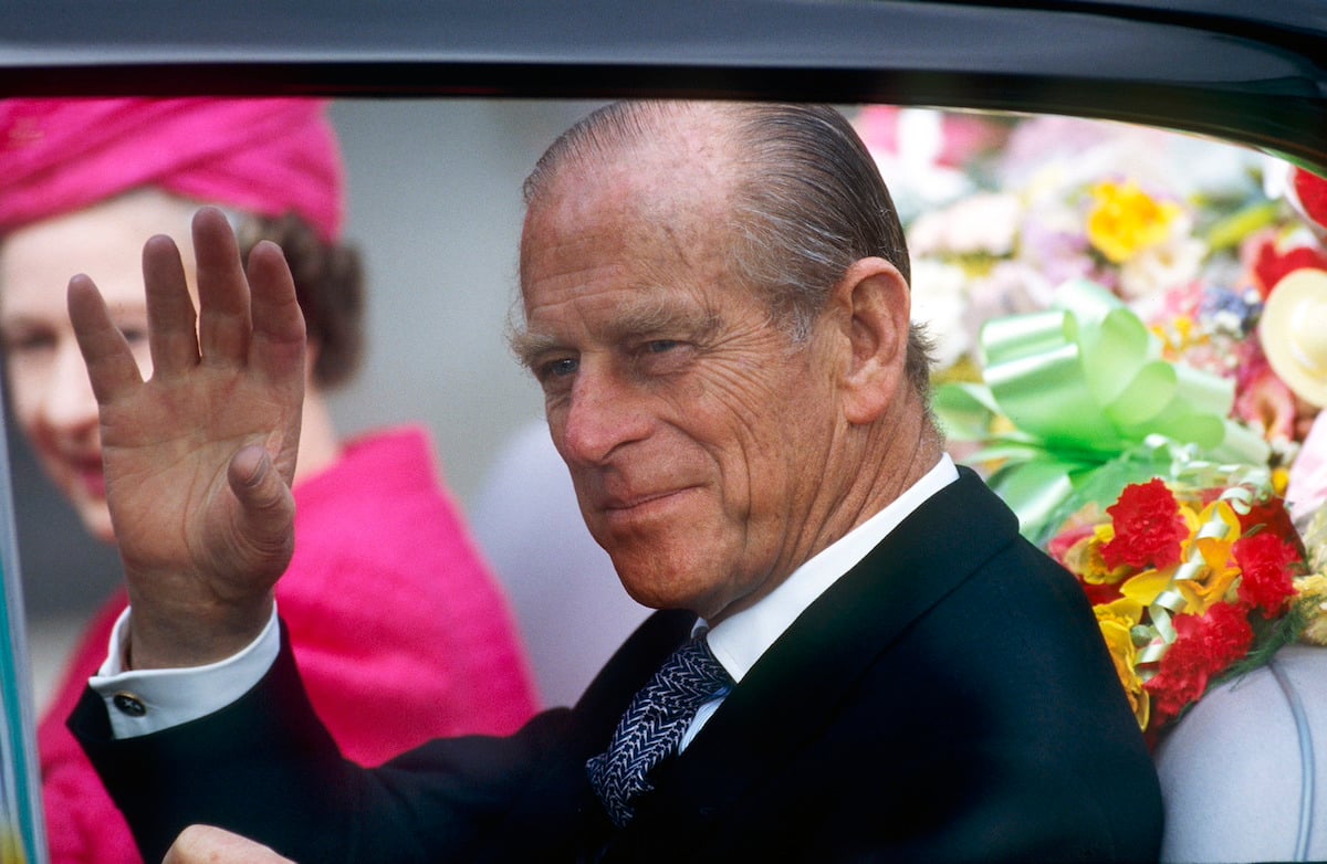 Prince Philip waving at a crowd