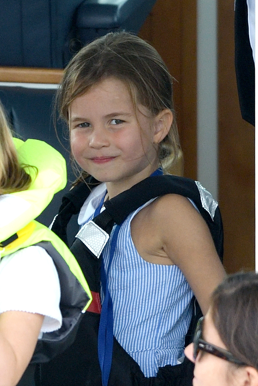 Princess Charlotte seated at the King's Cup Regatta in a pinstripe outfit 