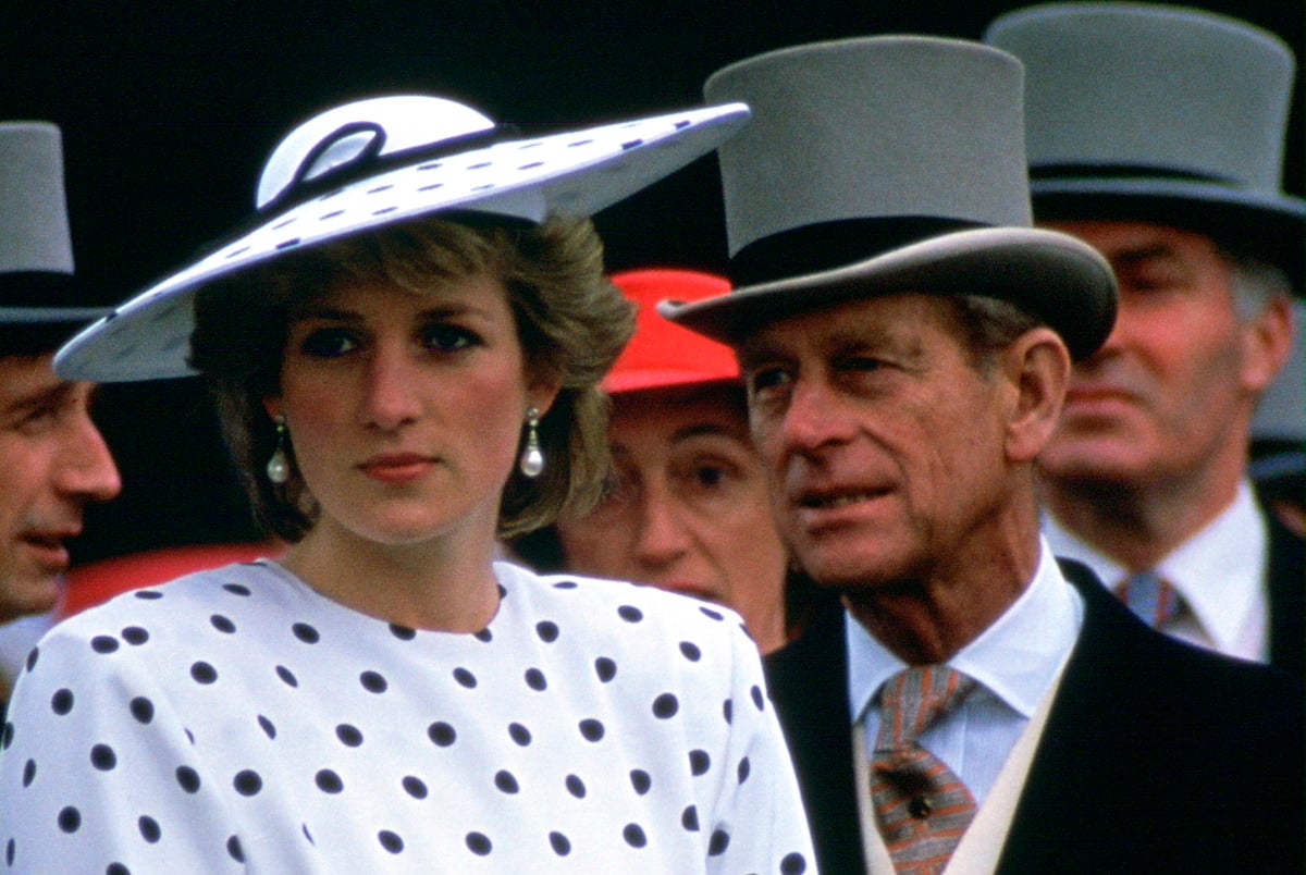 Princess Diana stands in front of Prince Philip on Derby Day