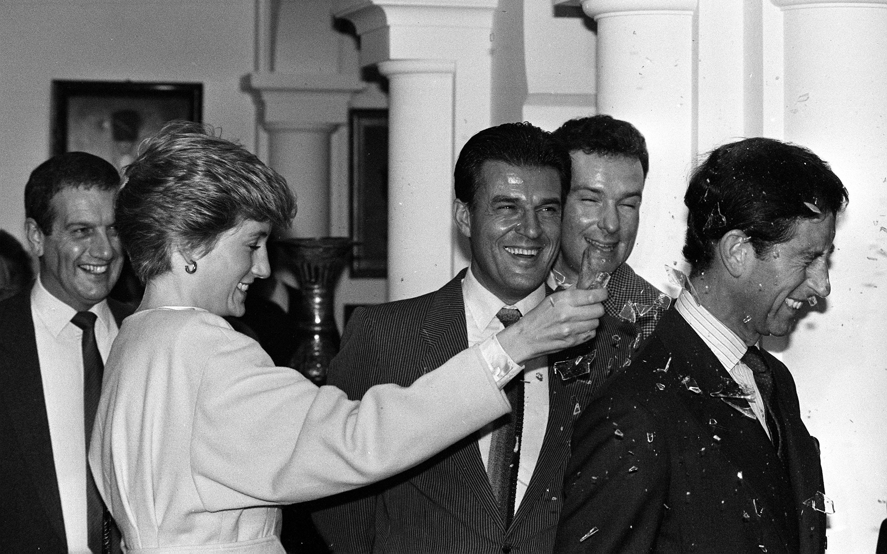 Princess Diana breaks a bottle over Prince Charles' head