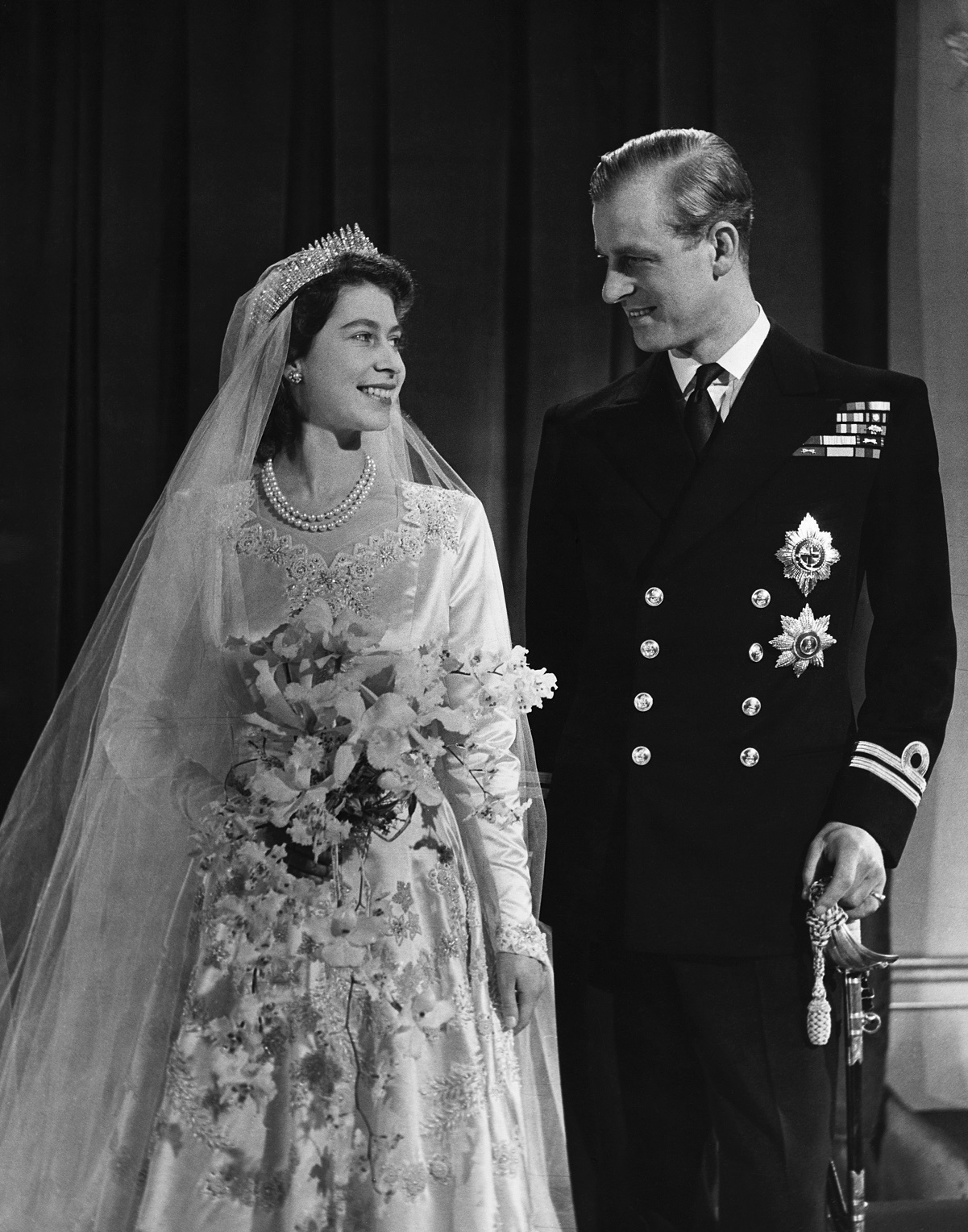 Princess Elizabeth later Queen Elizabeth II and her husband Philip smiling for their wedding portrait