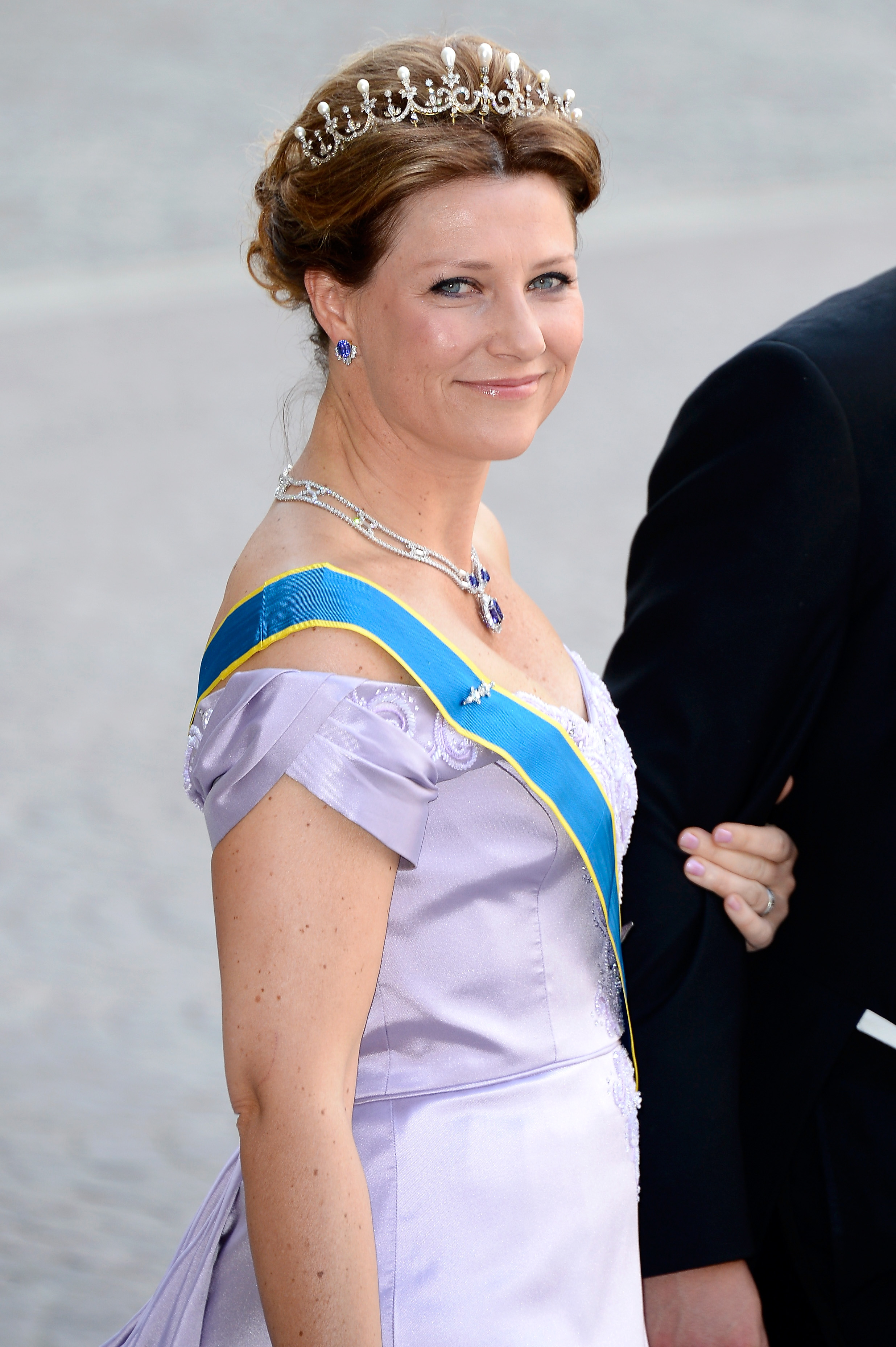 Princess Martha Louise of Norway wearing a gown and tiara at the wedding of Princess Madeleine of Sweden