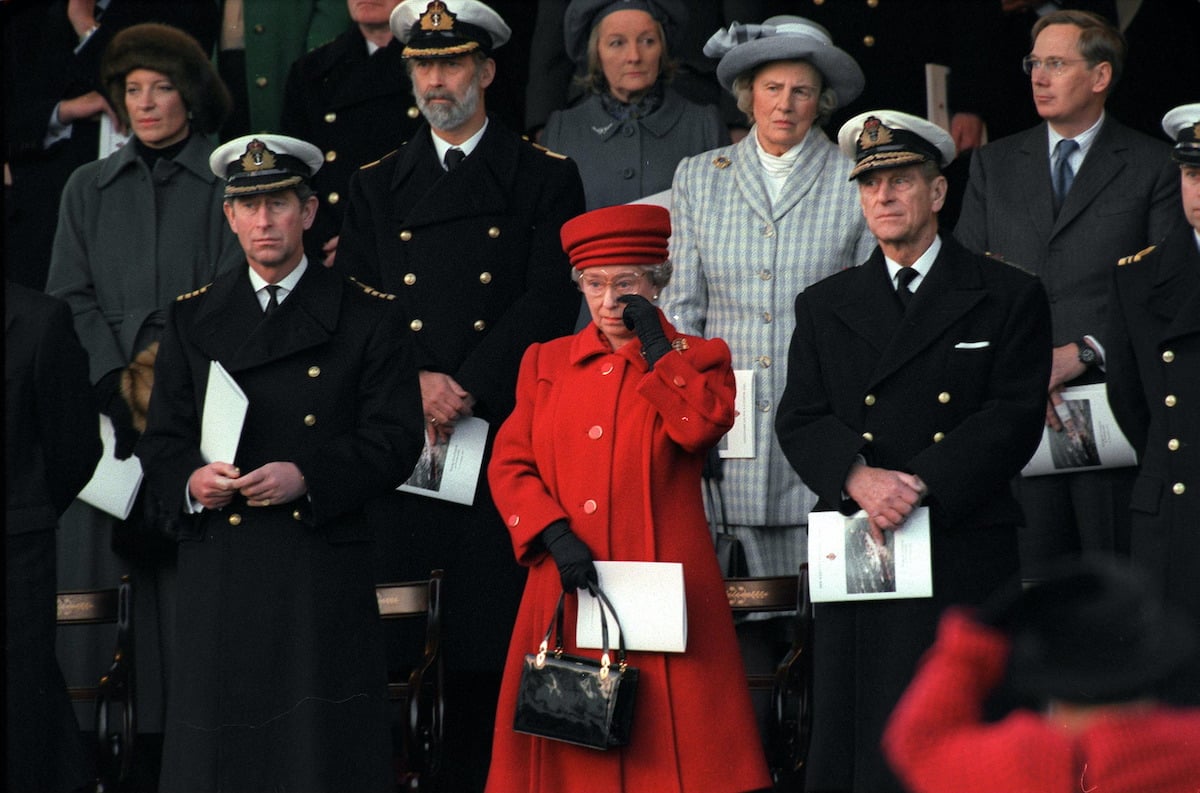 Queen Elizabeth wiping at tear at the decommissioning of Brittania