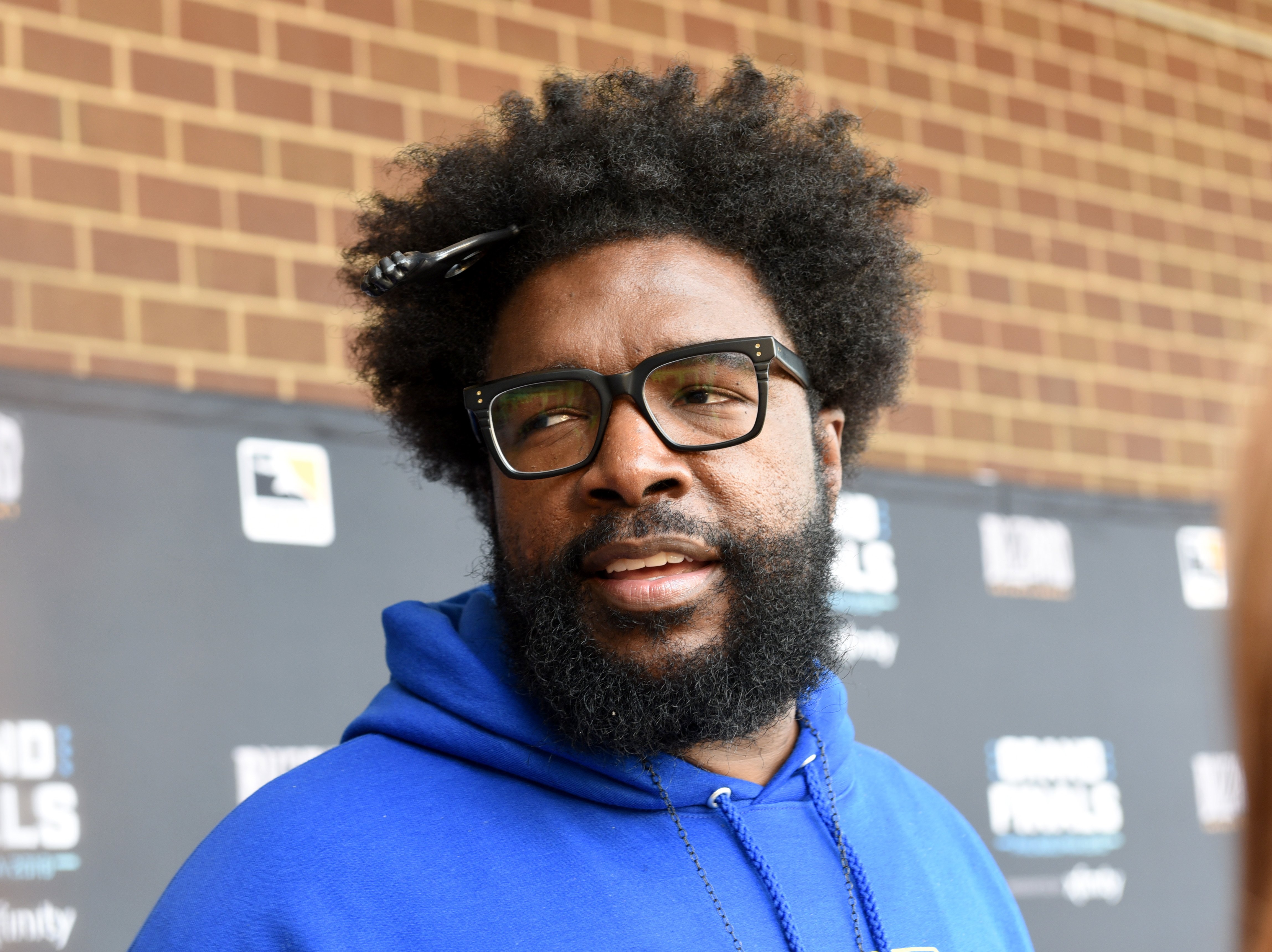 A close-up of Questlove's face looking away from the camera