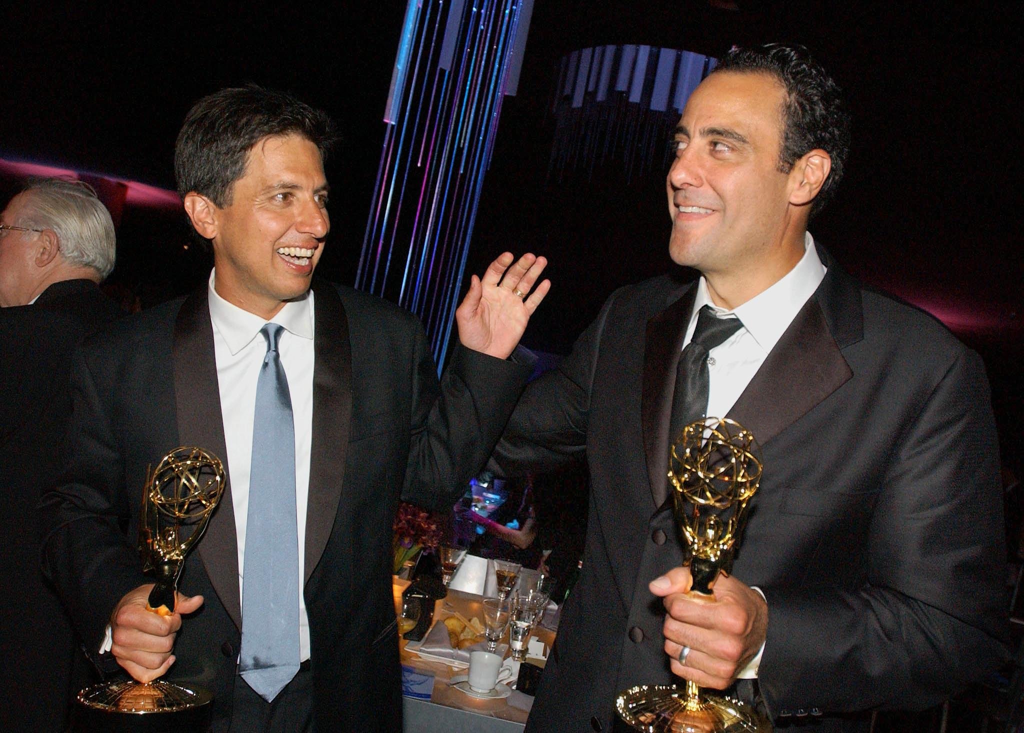Ray Romano (L) and co-star Brad Garrett (R) celebrate their Emmy wins at the Governor's Ball following the 54th Annual Emmy Awards at the Shrine Auditorium