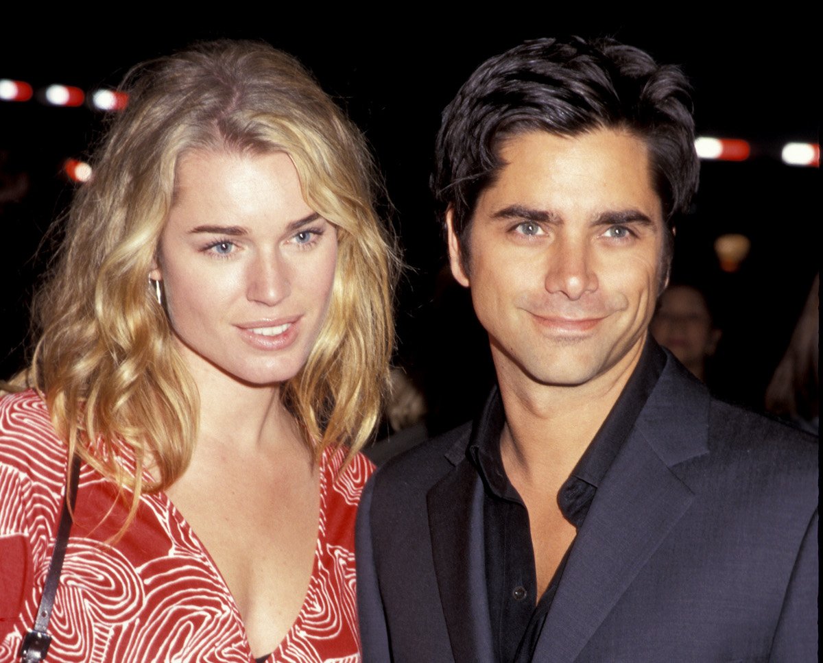 John Stamos and Rebecca Romijn smiling