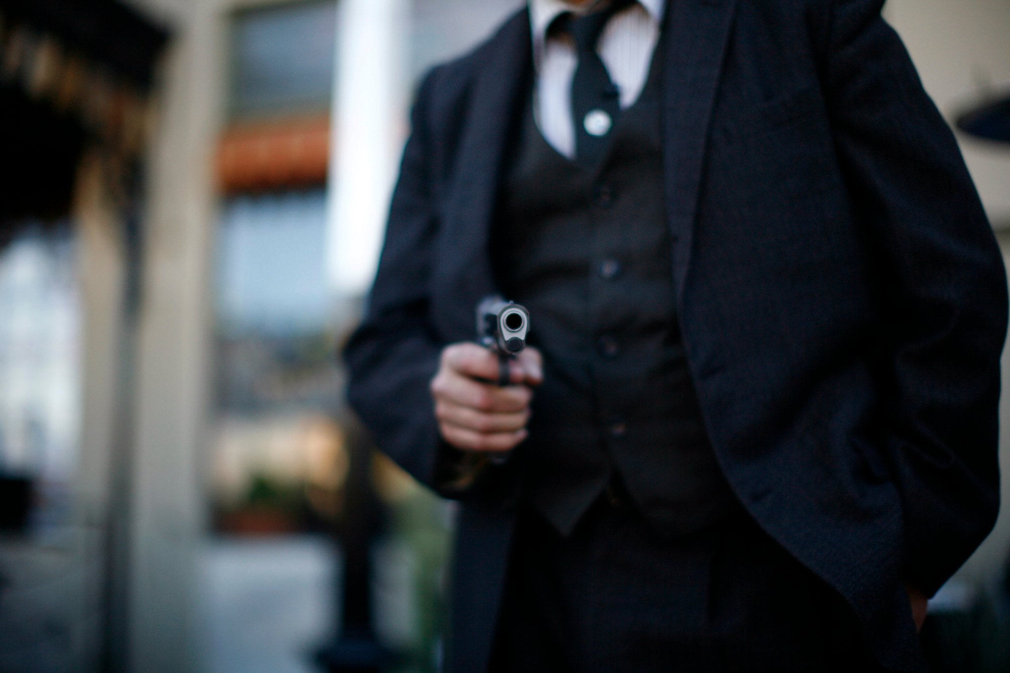 An actor points a prop pistol during the Dillinger Days event Tucson, Arizona
