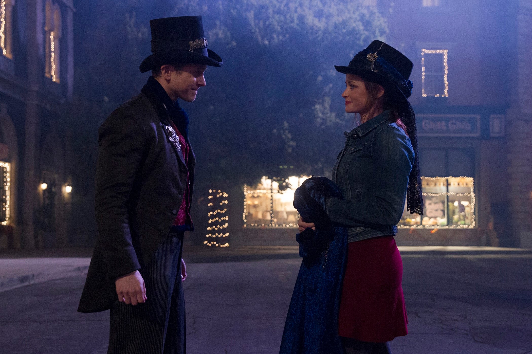 Logan Huntzberger and Rory Gilmore stand in the middle of the street in Stars Hollow during filming of 'Gilmore Girls: A Year in the Life'