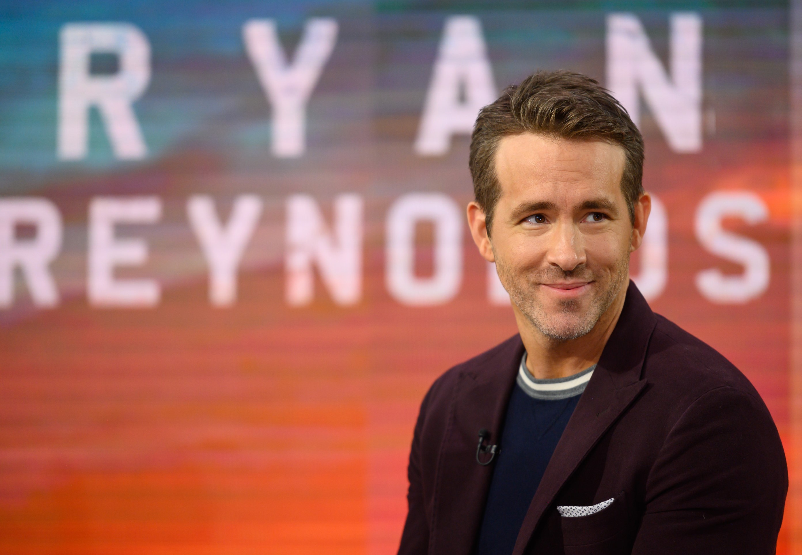 Ryan Reynolds smiling on the set of Today Show in 2019