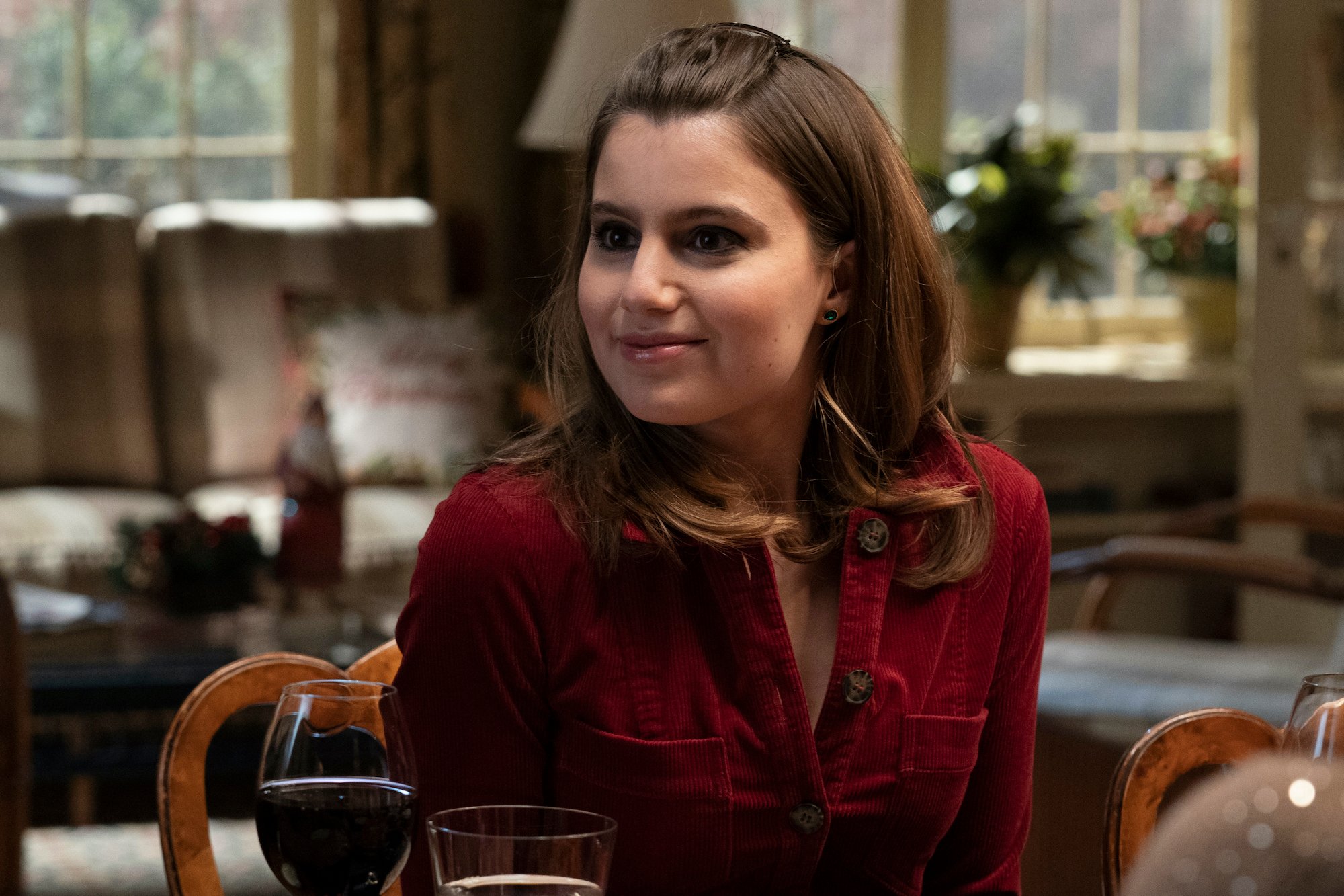 Sami Gayle as Nicky Reagan-Boyle smiling in front of a blurred living room